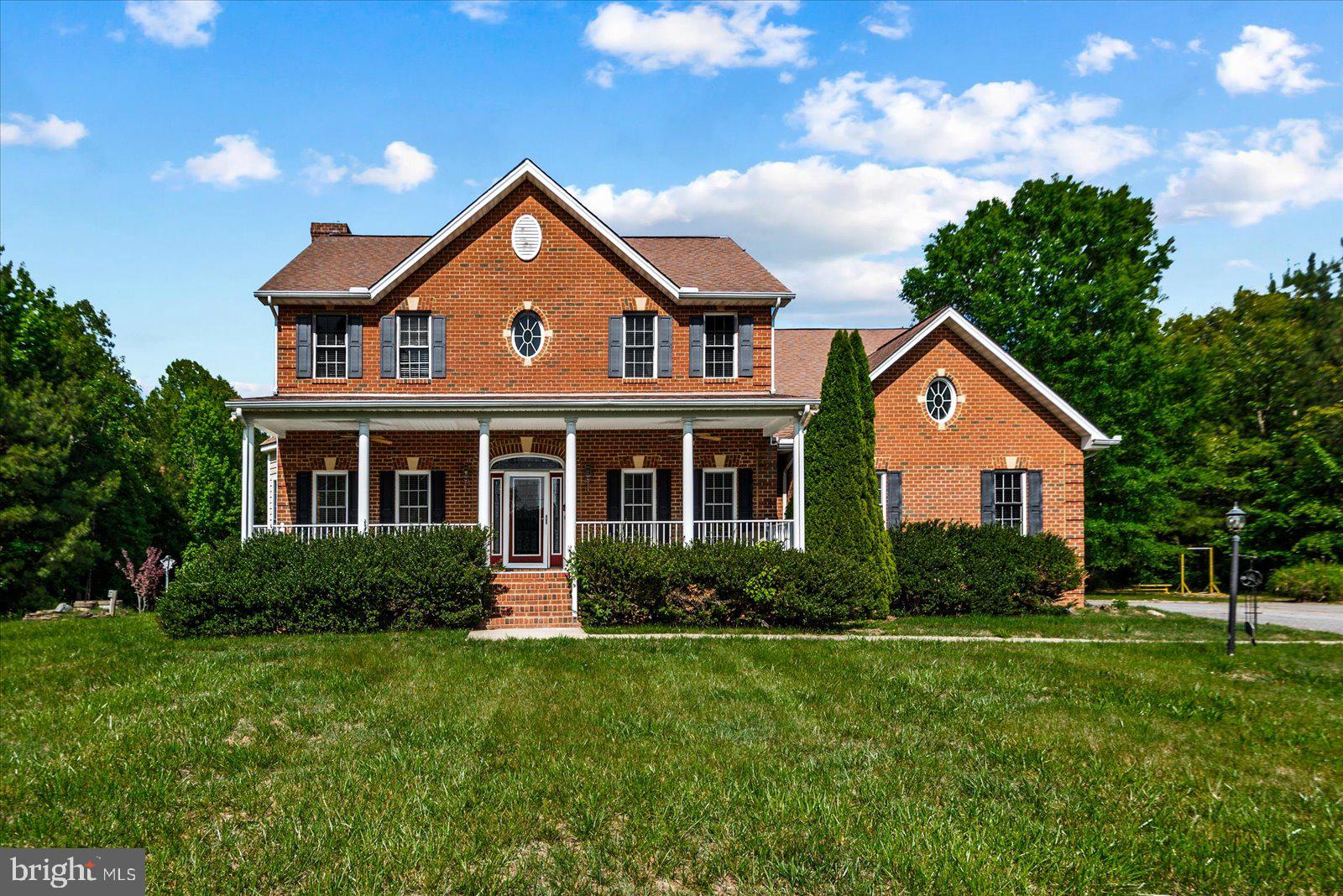 Exceptional Private Retreat on 10 Acres!

Welcome to your own slice of Virginia paradise in the heart of Caroline County. Nestled on 10 picturesque acres surrounded by mature trees, this beautifully updated home offers the perfect blend of privacy, comfort, and convenience. Whether you're looking for room to entertain, explore nature, garden, or simply unwind, this property delivers the lifestyle you've been dreaming of—all while being just minutes from Route 1 and I-95 for an easy commute to Fredericksburg and Richmond.

From the moment you step inside, you'll be impressed by the grand two-story foyer and the stunning floor-to-ceiling flagstone fireplace with a custom mantel, creating a warm and inviting focal point. Elegant arched openings between the living and dining rooms add timeless architectural charm and character.

Home Features:

-Spacious floor plan with **4 bedrooms and 3 full bathrooms** on the upper level.
-Luxurious primary suite featuring a private sitting area, oversized walk-in closet, and spa-inspired bath with a soaking tub, separate walk-in shower, and abundant counter space.
-Second bedroom with its own private en-suite bathroom—ideal for guests or multi-generational living.
-Bright walk-up lower level with a large recreation room, wet bar, full bathroom, and an additional room perfect for a home office, gym, or guest room.
-Brand-new hardwood flooring throughout the main level.
-Brand-new carpet throughout the upper level and all staircases.

Step outside to enjoy the beautifully refinished patio, a basketball court, and a detached garage/large shed overlooking approximately 2 acres of cleared land, offering endless possibilities for outdoor entertaining, gardening, a future pool, or creating your own backyard oasis. Beyond that, the remaining acreage provides your own private playground—perfect for hiking, camping, wildlife watching, or simply enjoying the peace and beauty of nature right outside your door.

Opportunities to own a beautifully upgraded home on 10 private acres at such a competitive price are exceptionally rare. If you've been searching for space, privacy, modern updates, and everyday convenience without sacrificing accessibility, this is the home you've been waiting for.

Schedule your private showing today before it's gone!