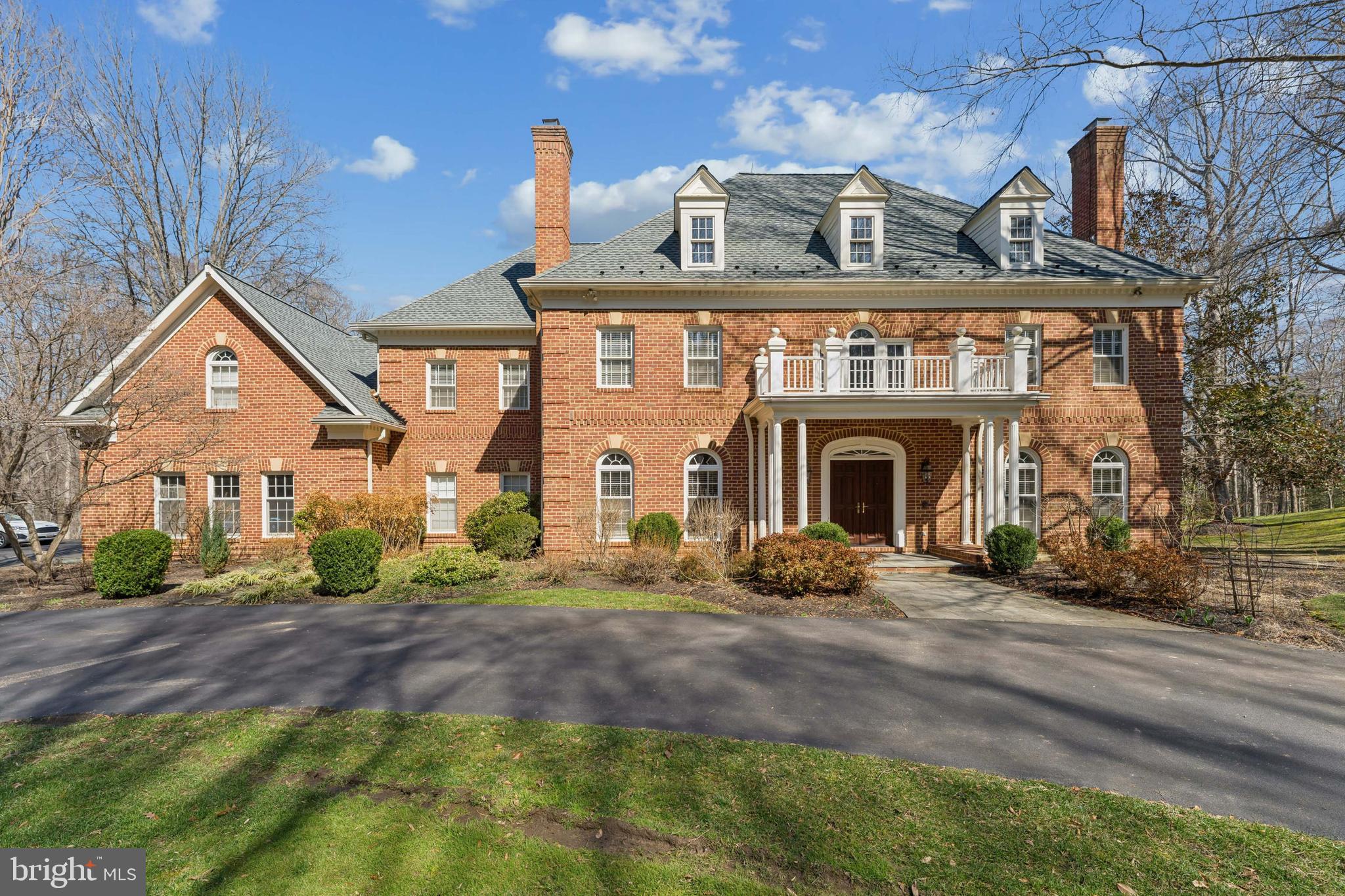 Welcome to this beautiful all-brick detached single-family home offering over 7,000 square feet of living space on a private 5-acre lot. A long driveway welcomes you and circles around the front entrance, continuing to the three side-load garages. Enter into a two-level open foyer featuring an elegant curved wood staircase. The main level offers formal living and dining rooms along with a dramatic two-level family room with a stone-accented fireplace. Hardwood floors run throughout the entire home. The recently remodeled gourmet kitchen features white custom cabinets, granite countertops, backsplash, and stainless steel appliances. The kitchen opens to a large deck overlooking beautiful views and a private heated swimming pool with a built-in hot tub. The upper level offers four spacious bedrooms and three full bathrooms. The primary suite features tray ceilings and a luxury full bathroom with heated tile floors, a spa-like soaking tub, separate standing shower, and huge walk-in closets. The upper level also offers a Jack and Jill bathroom for two of the bedrooms and a private full bathroom for the fourth bedroom. The fully finished basement offers a large recreation room, storage room, a full bedroom, and a full bathroom. The basement is a walk-out level leading to a patio and views of the backyard. The swimming pool will be filled and cleaned for the new buyers. Roof 2025, Washer/Dryer 2024, Upstairs water heater 2025, Basement water heater 2024