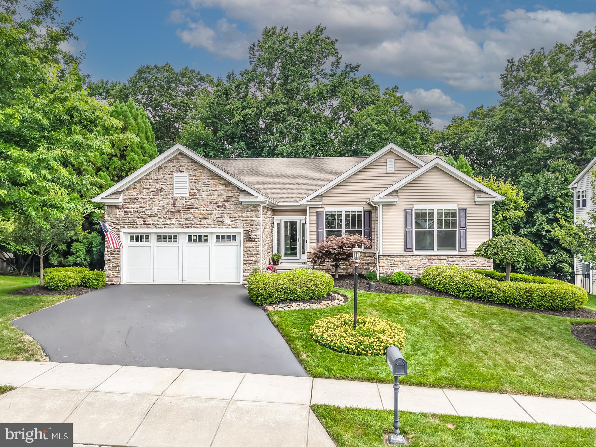 Welcome to 3345 Alydar Road in Crossing at Bailey Station, where one of the home's most unforgettable features isn't found inside the walls, but beyond them. Step outside into a meticulously crafted outdoor retreat where every pathway, stone, planting, and gathering space has been thoughtfully designed to blend seamlessly with the surrounding woods. While many homes in the community overlook neighboring properties, this residence enjoys the rare privilege of a private wooded backdrop transformed into an outdoor sanctuary where natural stone, retaining walls, river rock accents, mature landscaping, decorative lighting, wrought iron fencing, and a welcoming firepit work together to create an atmosphere that feels peaceful, timeless, and remarkably private. Rather than competing with nature, the landscape embraces it, creating a setting that is equally suited for entertaining a crowd, enjoying a quiet evening beneath the trees, or simply taking a moment to appreciate the beauty that surrounds you.

Located in Caln Township with a Downingtown postal address, this home was built in 2014 and has been thoughtfully enhanced well beyond its original construction with approximately $299,000 in documented improvements. Every upgrade reflects careful planning, quality craftsmanship, and a commitment to creating a home that is as functional as it is beautiful.

Inside, the bright, open floor plan welcomes you with wood flooring, a cozy fireplace, and inviting spaces designed for both everyday living and entertaining. The beautifully updated kitchen features new countertops, backsplash, gas cooktop, faucet, GE Profile appliances, and Century soft-close cabinetry, combining timeless style with everyday practicality.

The first-floor primary suite offers the convenience of main-level living with a spacious walk-in closet and private bath featuring dual vanities and a walk-in shower. Two additional bedrooms, another full bath, and a conveniently located laundry room complete the thoughtfully designed main level.

The fully finished walkout lower level is far more than additional square footage. It serves as a true extension of the home, offering a spacious recreation area, an additional bedroom with an egress window and walk-in closet, a beautifully finished full bath with a tiled walk-in shower, handcrafted steel barn doors, custom built-ins, and generous storage. Whether accommodating overnight guests, creating a private home office, pursuing hobbies, supporting multigenerational living, or hosting movie nights and celebrations, this level adapts effortlessly to your lifestyle.

Recent improvements include a new furnace and central air conditioning system, water heater, interior painting, updated lighting and fixtures, smoke detectors, garage door springs, and generator-related enhancements. Additional upgrades include the professionally finished walkout lower level, insulated garage door, generator-ready setup, leaf guards, and numerous carefully selected interior and exterior improvements completed throughout the years.

Perfectly positioned near Thorndale Station, shopping, restaurants, parks, fitness centers, and the Route 30 Bypass, this exceptional property offers the rare combination of extensive upgrades, flexible living space, and an outdoor environment unlike most others in the community.

Some homes impress with a list of features. Others leave an impression long after you've left. 3345 Alydar Road is that kind of home.

Buyer to verify square footage and measurements to their satisfaction.