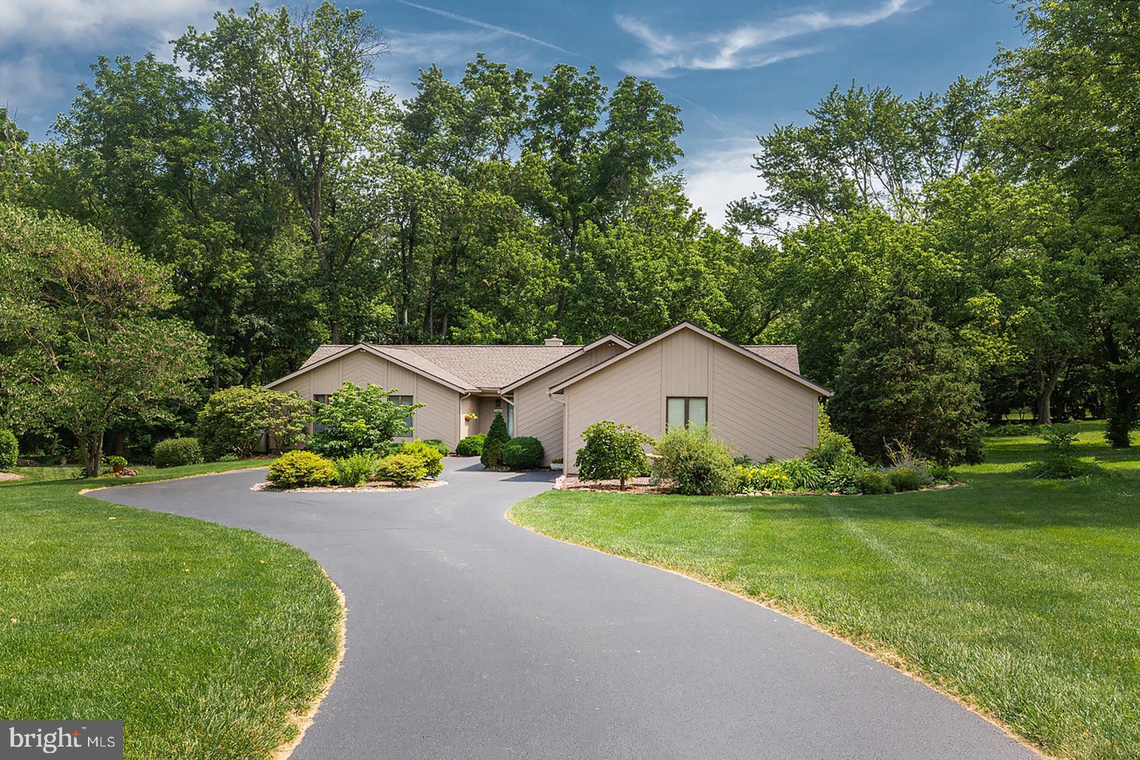 One floor living in this spacious California Style Rancher on Bentley Lane.   Pride of ownership is evident in this well cared for Three Bed and Two full bath and one half bath home.   Approximately 2,319 sq. feet, this home has plenty of space to spread out.  The large living room features a cathedral ceiling, a Stone fireplace, large windows and sky lights for great natural light.  The living room is open to a  generous size dining area.  The eat-in kitchen has 6 large windows with views of mature landscaping, Granite countertops, tile floors and ample cabinet space.  From the kitchen you can pass through to a family room or office, with cathedral ceiling, soft accent lighting, large windows and access to a large screened-in porch.  The is also a large wood deck with bench seating accessed from the screened porch and a grilling area.   A half bath with Granite counters that match the kitchen counters and a Laundry room are located just off the kitchen.  The extra large laundry also serves as a mud room and pantry with access to an amazing  3 car Garage.  The garage  has upgraded LED lighting and a work bench and is also heated and cooled.  At the opposite end of the home are 3 Bedrooms and two full baths.  The family bath has a tub/shower combo while the master bath has a large vanity area with double sinks, a sky light, a separate space for the commode and stall shower and a large walk-in closet The back yard is private with mature landscaping.   The driveway is circular for easy in and out access. This property is conveniently located with access to schools, shopping, healthcare, Conestoga Golf Club and just minutes to Millersville University or Downtown Lancaster.
