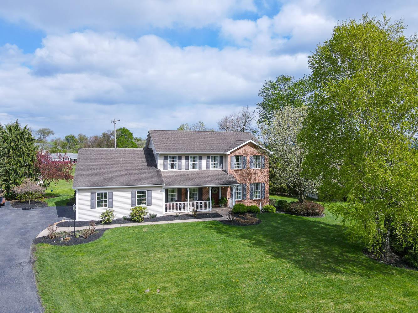 A stunning home nestled on a .63-acre lot in the heart of Centre Hall. This beautifully maintained, move-in ready two-story offers the perfect blend of comfort, style, and convenience. Filled with natural light, the home features warm hardwood floors, LVP, and tasteful, neutral finishes throughout.
Boasting four spacious bedrooms and 3.5 baths, the thoughtfully designed layout includes an updated eat-in kitchen with granite countertops, tiled backsplash, stainless steel appliances, and a breakfast nook. A new Bosch dishwasher and microwave range add modern convenience, while the kitchen flows seamlessly into a cozy family room with a gas fireplace—perfect for everyday living and entertaining.

The main floor also offers a laundry area, a convenient half bath, a formal dining room, living room, and a private office space. Upstairs, you’ll find four generously sized bedrooms and two full baths, providing plenty of room for family and guests.

The finished lower level expands your living space with a rec room, full bath, and abundant storage, along with an unfinished area for added flexibility. Additional updates include a new Trane heat pump (2020), hot water heater (2025), washer (2024), dryer (2022), and new carpeting in the lower-level rec room.

Enjoy outdoor living with a welcoming front porch, a beautifully maintained yard, and a patio area—ideal for relaxing or entertaining—all situated on a quiet cul-de-sac. Conveniently located just 15 minutes from State College and 10 minutes from Bellefonte and walking distance to Grange Fairgrounds.
