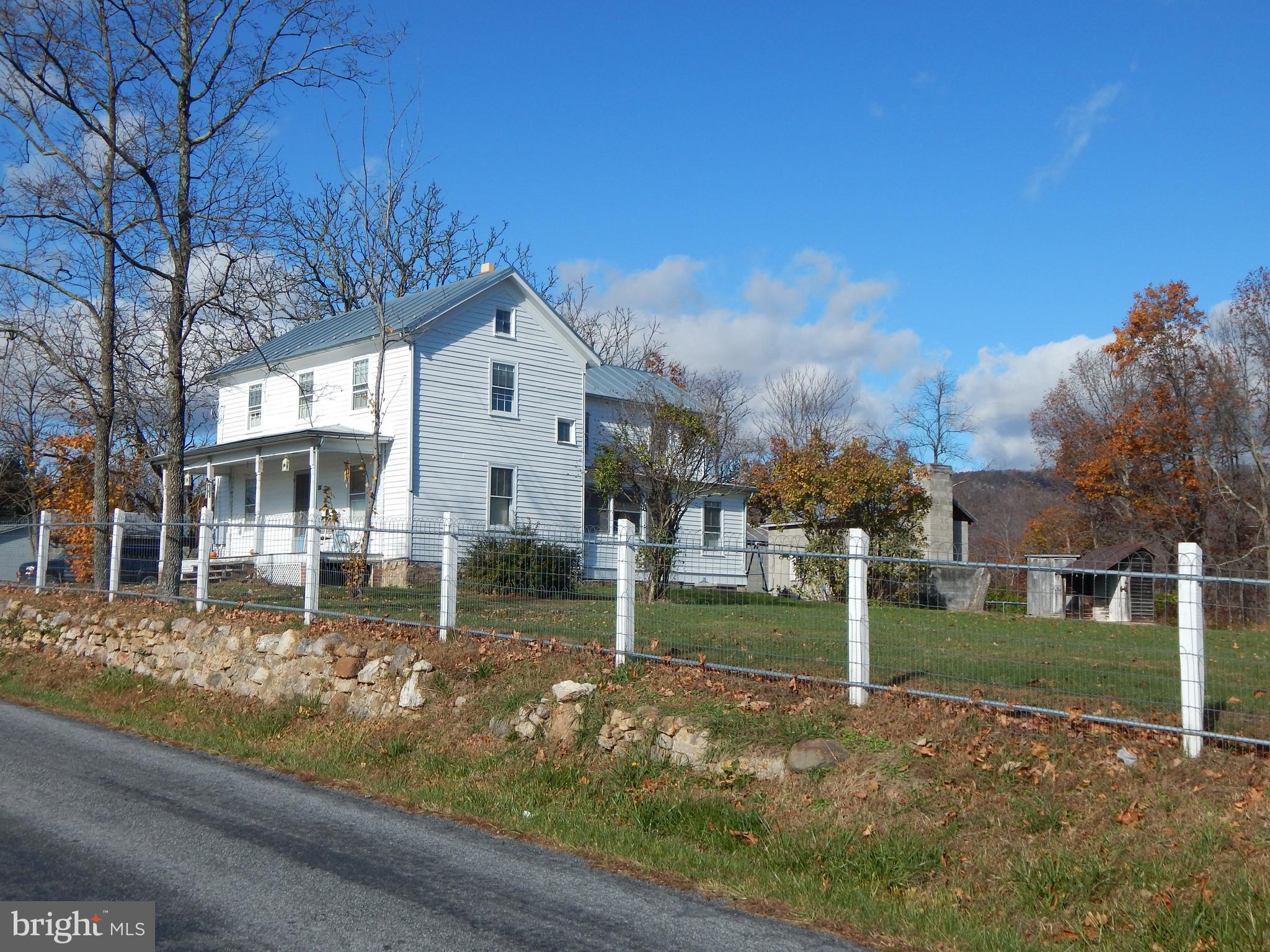 This is a renovated historic 1900's 2-story farmhouse located on Back Rd., Woodstock, VA.   This house has 3 bedrooms with a half bathroom upstairs.  The full bathroom is downstairs with a country kitchen complete with "press". There are 2 outbuildings for tenant use.  Tenant mowing & snow removal is required. Tenant Criteria will apply.  Credit Check, Background Check, Verifiable Income is Required,  Minimum Credit Score applies.  NO PETS, NO SMOKING.  Maximum occupants due to septic system is (4) four people .  This is a single family home.   A six (6) month lease would be considered for people between houses, short term work assignments, etc. (House could be furnished if needed, case by case) Owner/Agent.