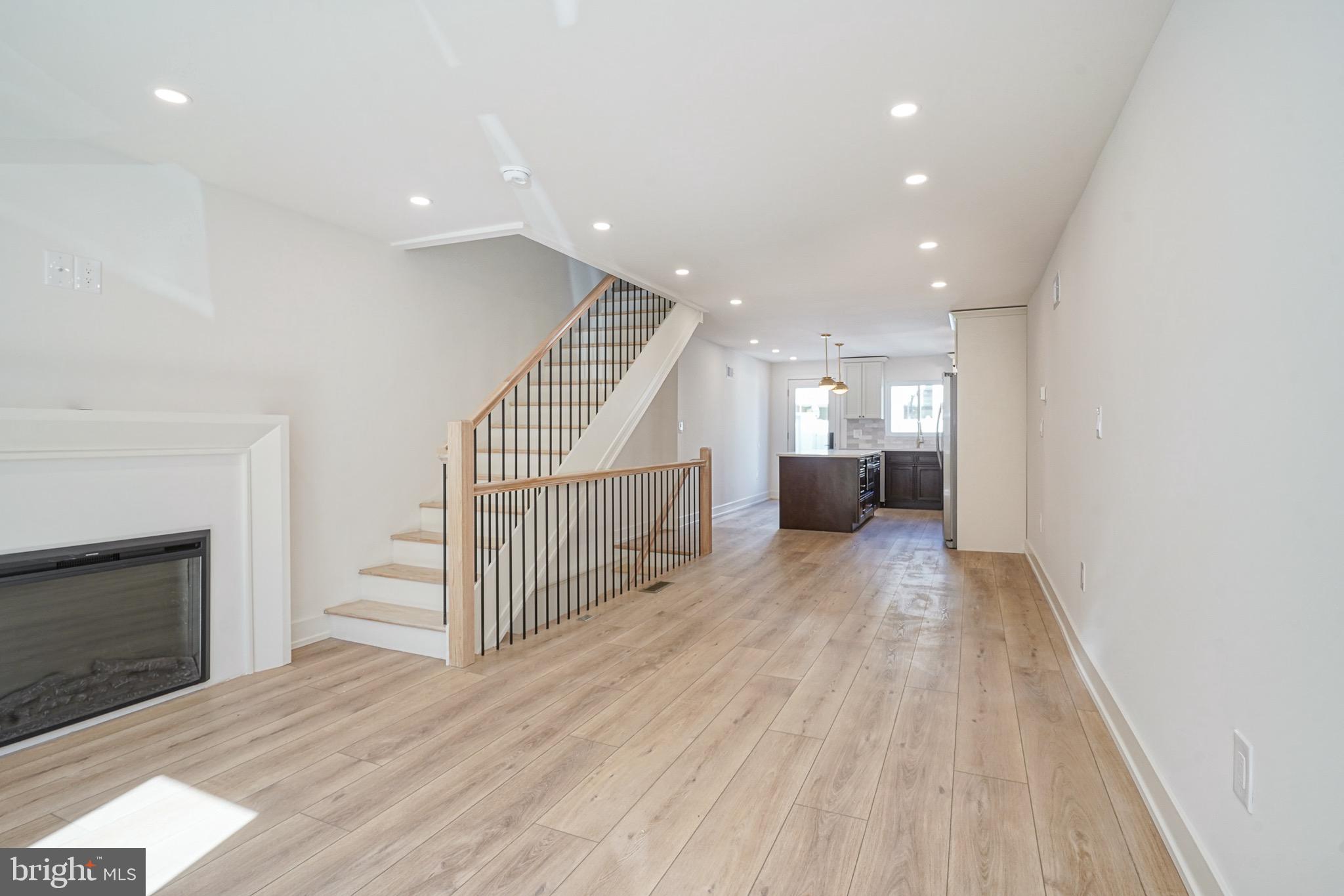 Welcome to 923 McClellan Street, a beautifully renovated 2-bedroom, 2-bathroom home in the heart of East Passyunk, one of Philadelphia’s most sought-after neighborhoods! Step inside to an open-concept living space featuring oak LVP flooring throughout and a sleek, wall-mounted electric fireplace that adds warmth and charm. The spacious dining area flows seamlessly into a chef’s kitchen, complete with white soft-close cabinetry, quartz countertops, subway tile backsplash, a pot filler, and brand-new stainless steel appliances. The oversized quartz island offers additional storage, a built-in microwave, and stunning luxury light fixtures, making it the perfect space for entertaining. From the kitchen, step out into the expansive private yard with white vinyl fencing, ideal for outdoor dining, barbecuing, or simply relaxing. The fully finished basement provides additional living space—perfect for a media room, home office, or entertaining area. On the second floor, you’ll find two generously sized bedrooms with ample closet space. The stylish hall bathroom boasts a navy vanity with a quartz top, mosaic tile flooring, and a subway-tiled shower with brass gold fixtures. For added convenience, a hallway closet that can house a stackable washer and dryer. The primary suite features a private en-suite bathroom with elegant brass finishes and a beautifully tiled stand-up shower.
Located just steps from Passyunk Square, some of the city’s best restaurants and bars, BOK Bar, the Italian Market, and a short trip to Philly Live! Casino and sports complexes, this home offers the perfect blend of modern living and urban convenience. Don’t miss your chance to own this stunning East Passyunk gem—schedule your showing today!