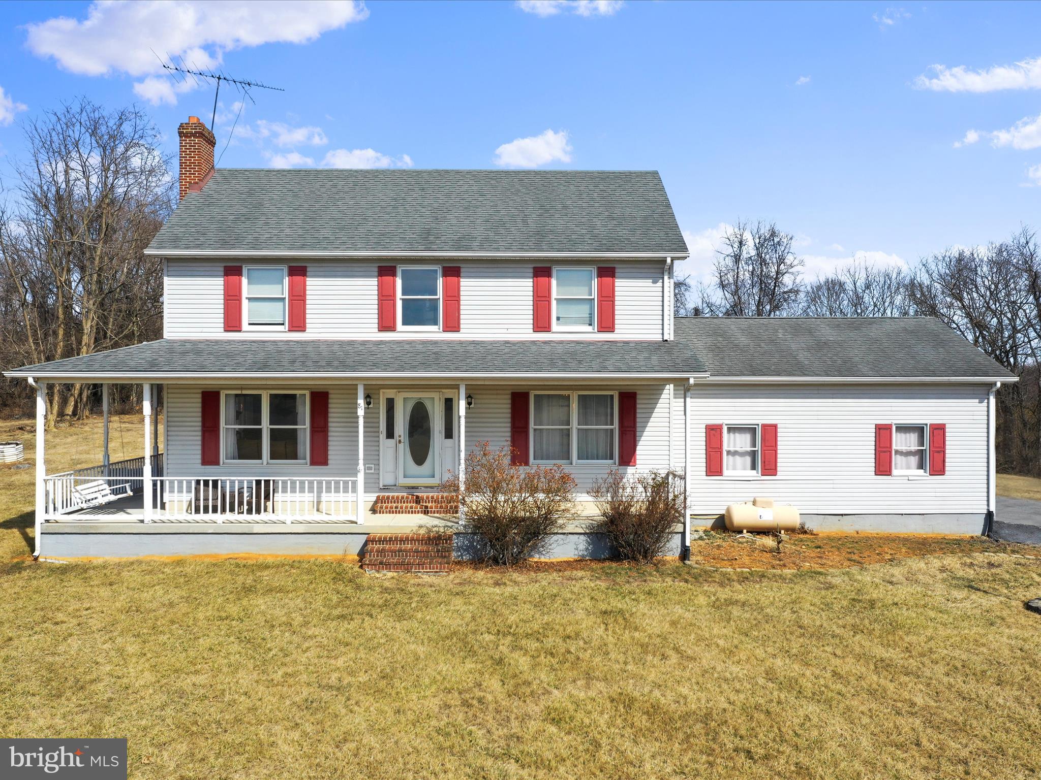 Great Colonial style home in a country setting with almost 2 acres close to the Virginia line for commuting. Relax on the front porch enjoying the view with coffee in the morning or relax in the hot tub off of your back deck in the evening.  This home features 3 bedrooms and 3.5 baths. The first floor offers a country kitchen with granite countertops and easy close cabinets. Family room with a gas fireplace. A dining room , a laundry and a half bath.  Upstairs is the primary bedroom with walk in closet and full bath. two other spacious bedrooms with a full bath. The walk up and out basement offers a second kitchen, bar area, exercise room, den and a rec room with wood burning stove.  A large 2 car garage , landscaping and shed completes this home. One year home warranty provided by the seller. A Must See!!