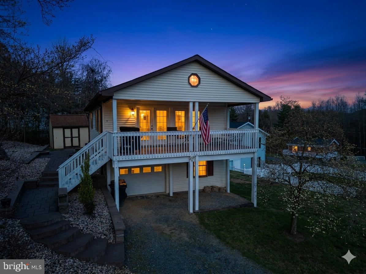 The centerpiece of this move-in-ready home is the large covered front porch, offering a serene, elevated view of Lake Louisa. Located in the gated community of Blue Ridge Shores, this property grants you access to an incredible array of amenities, including a private marina, multiple sandy beaches, a clubhouse, tennis and basketball courts, playgrounds, and miles of scenic walking trails. Whether you are looking for a full-time residence or a weekend retreat, the lifestyle here is truly unmatched.
This 3-bedroom, 2 full baths has been meticulously updated. Extensive 2021 upgrades include an updated kitchen with granite countertops, new windows, new front doors, updated lighting, and fresh flooring throughout the first floor. Both full bathrooms have been beautifully remodeled—the upstairs in 2021 and the downstairs in 2025. Outside, professional hardscaping enhances the curb appeal, while the 1.5-car garage provides ample space for your vehicle and lake gear. This turnkey gem perfectly blends modern comfort with the best of lakeside living. The previous buyer's finances fell through. An FHA buyer can pick up the previous file and close in 2 weeks or less.