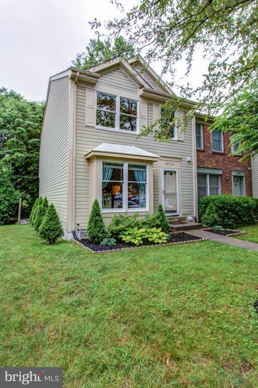 Great end unit, finished lower lvl w/ fpl, shady deck, new carpet & flooring. Big ticket items updated: roof, HVAC, rear windows, fridge, toilets   ready to move in! Eat in kitchen, HDWD in dining rm, bumpout window in living rm. Vaulted ceilings upper lvl. BA rough in lower lvl. Walk to lake, pool, shops, tot lot, close to 270. Pool, lawn & amenities. Extra storage built in. 2 assigned parking.