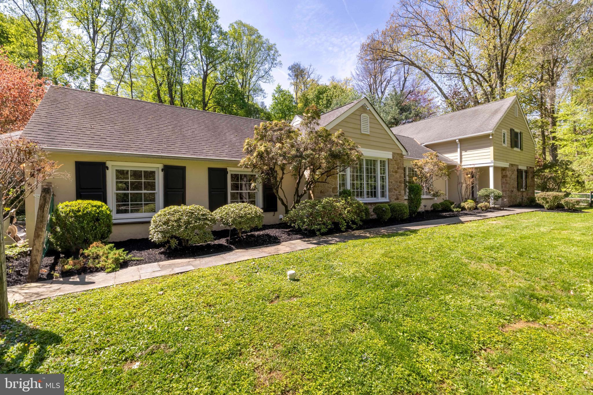Welcome to your own private oasis. This beautifully maintained 4-bedroom, 2 full and 2 half bath Cape sits on nearly 3 acres in desirable Springfield Township.

Enter through the newly renovated mudroom featuring custom cabinetry, which leads to a spacious laundry room complete with a dog bath/shower and a generous walk-in pantry—perfect for everyday convenience.

The heart of the home is the expansive eat-in kitchen with vaulted ceilings, showcasing Wood-Mode cabinetry, a Viking stove, Sub-Zero refrigerator, and a built-in wine fridge. The sunlit dining room and large living room offer ideal spaces for entertaining, while a cozy paneled den provides a perfect retreat.

The first-floor primary bedroom is conveniently located alongside a second bedroom and a beautifully updated custom bathroom. Living areas open to a stunning flagstone patio that overlooks a sprawling, wooded backyard—an ideal setting for relaxing or hosting gatherings.

Upstairs, you’ll find two large, sun-filled bedrooms with a shared full bath, along with a second-floor laundry area for added convenience. There is also a small den with a skylight and a home office.

Perfectly situated just steps from Forbidden Drive, near Lafayette Hill shopping, and only minutes from the dining and boutiques of Chestnut Hill, this home offers a rare combination of privacy and accessibility.

Don’t miss the opportunity to make this exceptional property your own.