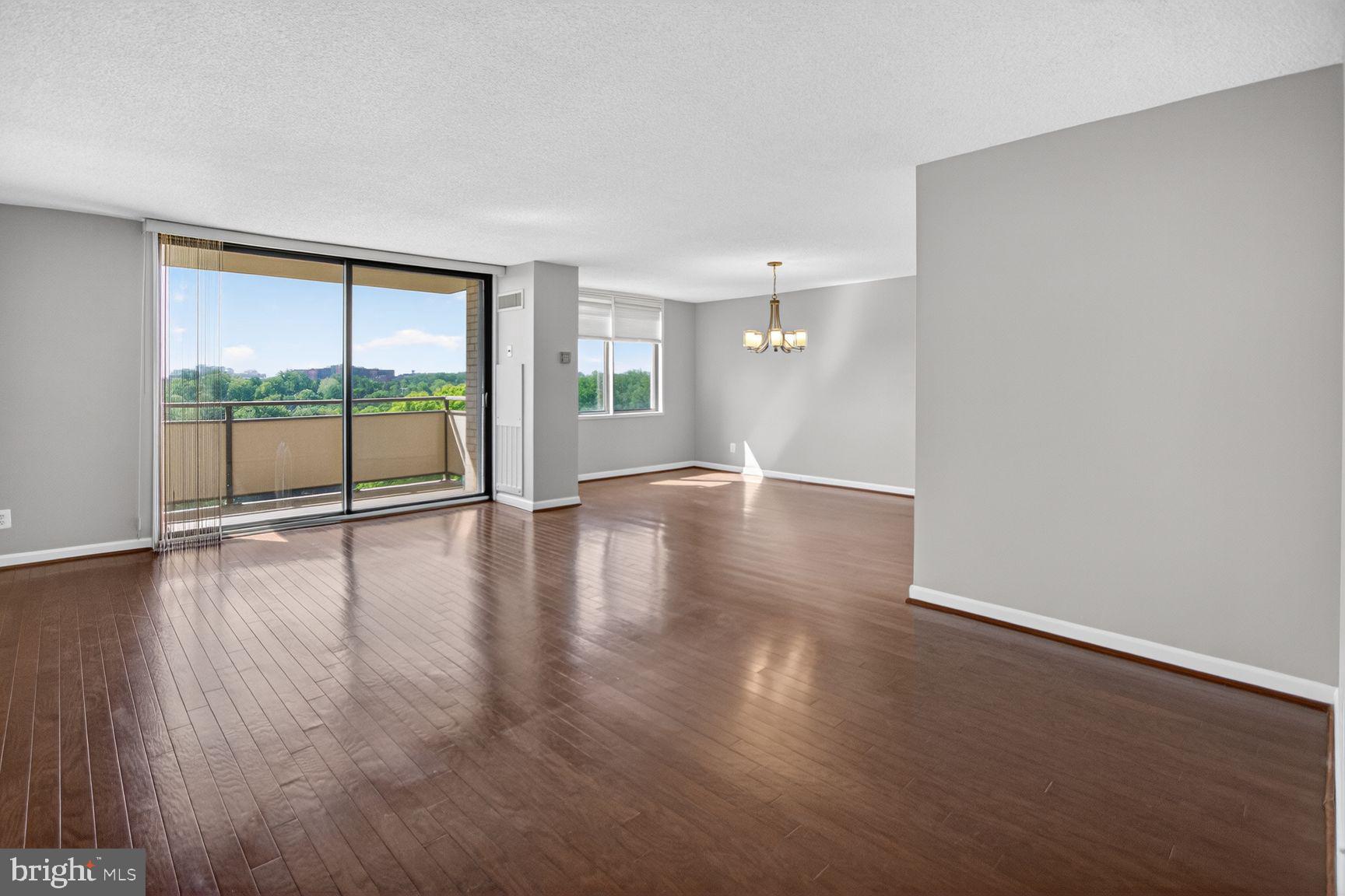Welcome to this spacious 2-bedroom, 2 bath in the highly desirable Promenade Towers in Bethesda. Bathed in natural light, this is one of the larger two-bedroom apartments with 1,330 sq.ft of living space with hardwood floors throughout. The expansive living room area leads to an oversized balcony overlooking both the tennis courts and the gardens. Retreat to the serene primary suite with a large bedroom complete with a walk-in closet and ensuite bathroom with walk-in shower.  The second bedroom is also a generous size. The second bath is a combination tub/shower.  With all utilities and property taxes included in the monthly co-op fee, homeownership is seamless and stress-free. Garage parking comes with the unit. Living at The Promenade means enjoying resort-style amenities in a beautifully maintained, park-like setting. Take advantage of the fitness center, indoor and outdoor pools with adjacent grills, tennis/pickle ball courts, walking trails, dry cleaners, beauty salon, market/deli, restaurant, 24/7 security, and more. With electric vehicle charging stations, a car wash station, and direct access to public transportation, including the Ride On Bus to two nearby Metro stations, commuting is effortless. The bus comes directly to the door of the Promenade. Close proximity to the Red Line Medical Center metro stop at NIH/Walter Reed and Grosvenor metro with easy access to 495 and 270. Nearby Wildwood Shopping Center with Balducci’s, CVS, Bethesda Bagels, Starbucks, restaurants and several boutiques and a Giant food across the way. Don’t miss the opportunity to own this exceptional home in one of Bethesda’s most sought-after communities!