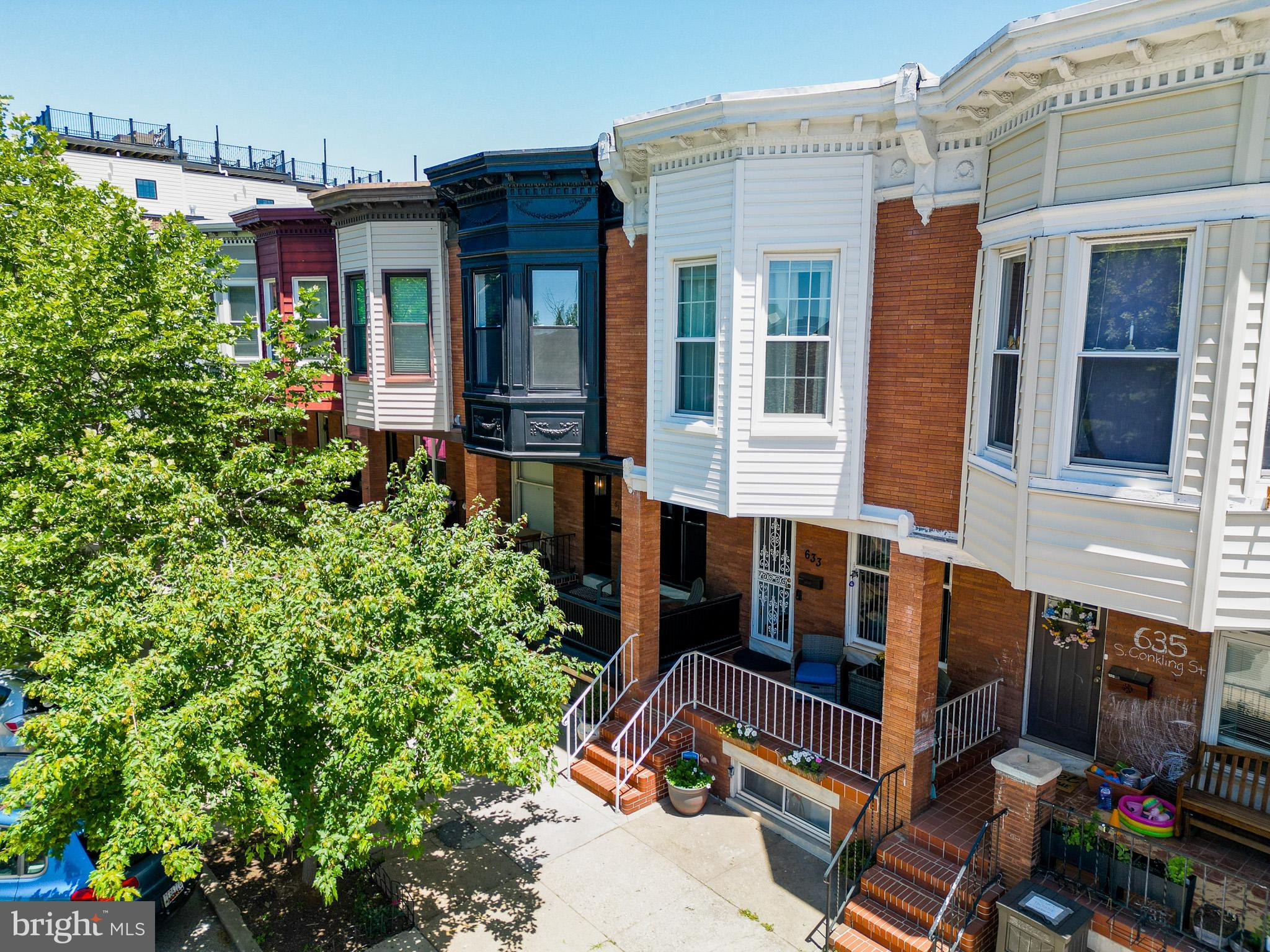Welcome to 633 S Conkling Street, a beautifully updated home in the heart of Brewer’s Hill.
This spacious 3​ bedroom, 2.5​ bath row​ home blends classic Baltimore charm with thoughtful modern upgrades. ​O​nce inside ​you will find ab open-concept main level featuring gleaming hardwood floors with custom inlays, a cozy gas fireplace, and a convenient half bath ideal for everyday living and entertaining. The oversized eat-in kitchen is a standout, complete with 42” cabinetry, stainless steel appliances, a deep sink, and a defined pantry. Just off the kitchen, double doors lead to a low maintenance Trex deck perfect for outdoor dining or relaxing. Upstairs, you’ll find three generously sized bedrooms with large windows, an oversized hallway closet, and a full bath. The partially finished lower level adds valuable flexible space ideal for a second living area, guest suite, or potential fourth bedroom along with a full bath, utility room, and rear walkout.