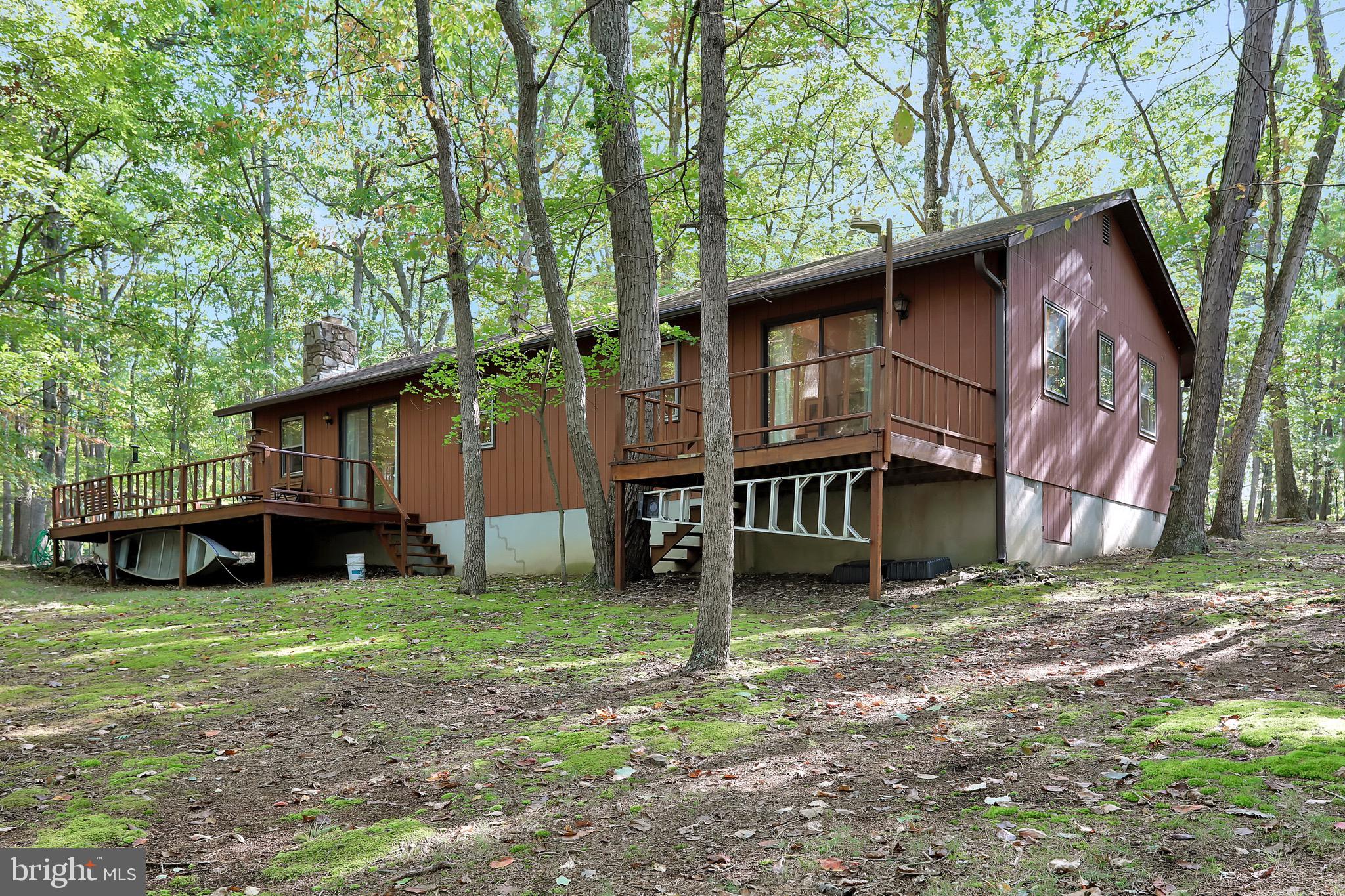 Perfect 2nd Home - One Level Cabin on 26.79 Acres of Absolute Privacy in Highly Sought After Gated Community of River Ridge!  Only 2.2 Miles from Route 9!  Open Layout in Main Living Area - Kitchen/Dining Area with Center Island & Main Entrance, and Living Room with Wood Burning Fireplace & Sliding Door to Rear Deck. Master Bedroom with Attached Full Bathroom, Sitting Area, & Sliding Door to 2nd Rear Deck.  Bedroom #2, Bedroom #3, Additional Bedroom #4/Office (Walk Through Bed #3 for Access), Full Bathroom #2 in Hallway with Laundry.  Detached Workshop with Electric with Garage Bay.  Property Includes Lot #'s 62-65.  Furniture May Convey.