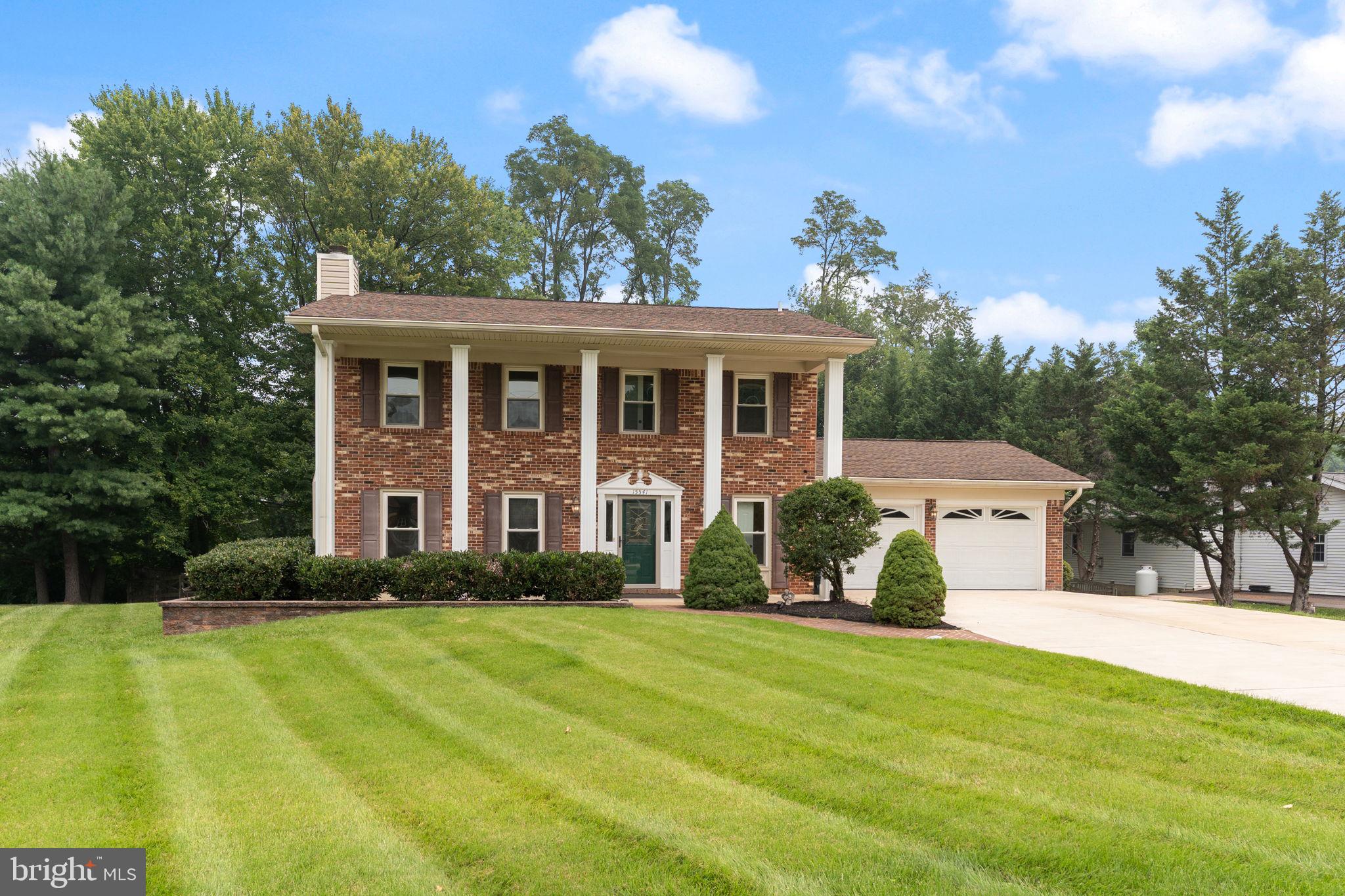 Welcome to this impressive brick-front Colonial, beautifully situated on more than half an acre in the sought-after Norbeck Hills community of Silver Spring. Offering four bedrooms, two-and-a-half bathrooms, generous living spaces, and numerous updates, this home is designed for comfortable everyday living and effortless entertaining.
The main level features hardwood flooring, spacious formal living and dining rooms, and a stunning rear great-room addition with vaulted ceilings, dramatic arched windows, and a floor-to-ceiling wood-burning fireplace. The kitchen includes custom cabinetry, ample counter space, and an open flow into the breakfast area and great room.

Step outside to enjoy the screened porch, expansive paver patio, landscaped walkways, and retaining walls. The large, fenced backyard provides plenty of room for entertaining, gardening, recreation, and relaxation. A powered storage shed, oversized two-car garage, and concrete driveway provide additional convenience and functionality.

Major exterior improvements completed around 2017 include an architectural-shingle roof, a metal roof over the porch, replacement windows, added exterior insulation, new siding, gutters with gutter guards, and aluminum-wrapped soffits and fascia. The home’s plumbing was upgraded to PVC, and all bathrooms were completely remodeled around 2016. Additional updates include a renovated kitchen with custom cabinetry and replacement appliances, as well as a newer washer and dryer installed around 2022.

Conveniently located near the ICC, major commuter routes, shopping, restaurants, schools, golf courses, parks, and recreational amenities. This spacious and extensively improved home offers exceptional indoor and outdoor living in a desirable Silver Spring location.