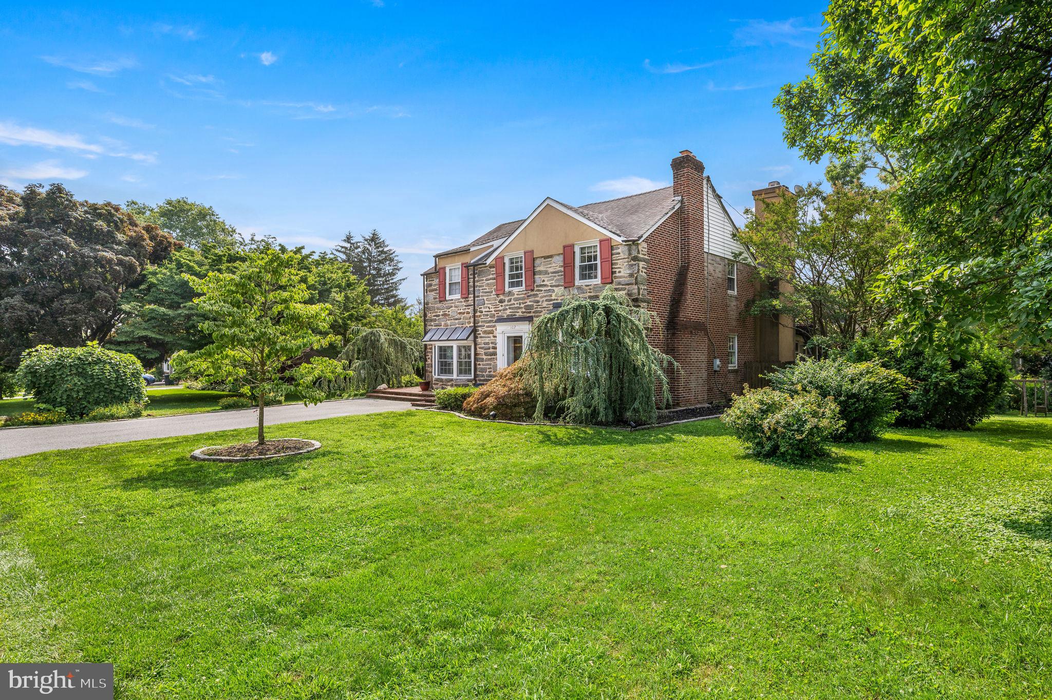 Stately stone single home on quiet cul-de-sac. The amazing two story addition really makes this a one of a kind home. The first floor features an incredible open floor plan with a formal living room with fireplace, a large dining room that opens to a gourmet kitchen and breakfast nook and an oversized family room with another fireplace and full bathroom. The kitchen offers a 6 burner gas cook top as well as a full  built-in range, built-in wine fridge, OG edged level 4 black pearl granite, Italian custom tile floor & backsplash and bow window. The second floor features 4 amazingly sized bedrooms and a full hall bathroom. The primary bedroom suite with fireplace, vaulted ceilings and skylights also offers a full bathroom with soaking tub jetted tub and stall shower. The spacious walk-in closet features the super convenient laundry. The basement also has hook up for laundry.  Brand new $35,000 boiler system installed fall 2022 so the house has 7 heating zones to offer you and your guests the utmost in comfort when both heating and cooling. AC is brand new single zone. The yard features designer landscape plantings with two weeping blue atlas cedars, a dogwood and other various shrubs and plants. There are two large decks one lower level and one off of the primary bedroom. Large yard, quiet cul-de-sac  and walking distance to all of Media Borough attractions.