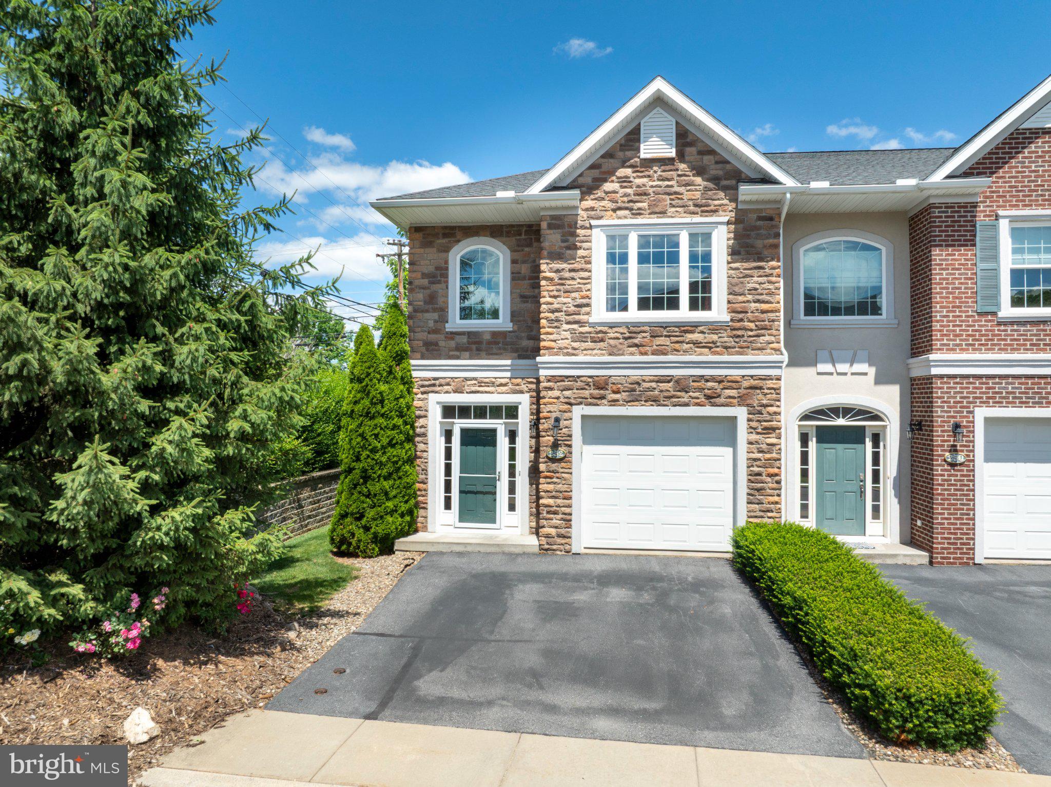 Discover this quality end‑unit in Wiltree Condominiums offering 3 bedrooms, 3.5 baths, and more than 2,100+ finished square feet across three comfortable levels with fresh paint and new carpet upstairs. The main floor features beautiful red oak hardwoods and a kitchen designed with timeless appeal—maple cabinetry, dark granite counters, and a light tile backsplash that adds just the right contrast. The open living/dining area keeps everyone connected, while glass sliders lead to a semi‑private fenced patio ideal for morning coffee or quiet evenings outside. A half bath and interior garage access round out the main level. Upstairs, a thoughtful layout includes second‑floor laundry, two well‑sized bedrooms, and a full hall bath. The expansive primary suite stands out with a backlit tray ceiling, generous walk‑in closet, and a stylish ensuite bath featuring a glass‑tiled shower and dual‑sink vanity. The finished lower level offers great additional living space with a rec room, full bath, and egress window—perfect for hosting, hobbies, or movie nights. Utilities are neatly tucked into the unfinished areas, leaving room for storage. Positioned at the back of the community for added privacy, this unit also benefits from a new roof for peace of mind. The condo fee covers water, sewer, trash, snow removal, lawn care, plus common area and exterior maintenance, supporting an easy, low‑maintenance lifestyle. Enjoy nearby parks, the YMCA, and quick access to downtown State College. South Hills School, the high school, and Welch Pool are also just minutes away. Schedule your showing today and experience the comfort and convenience of Wiltree!