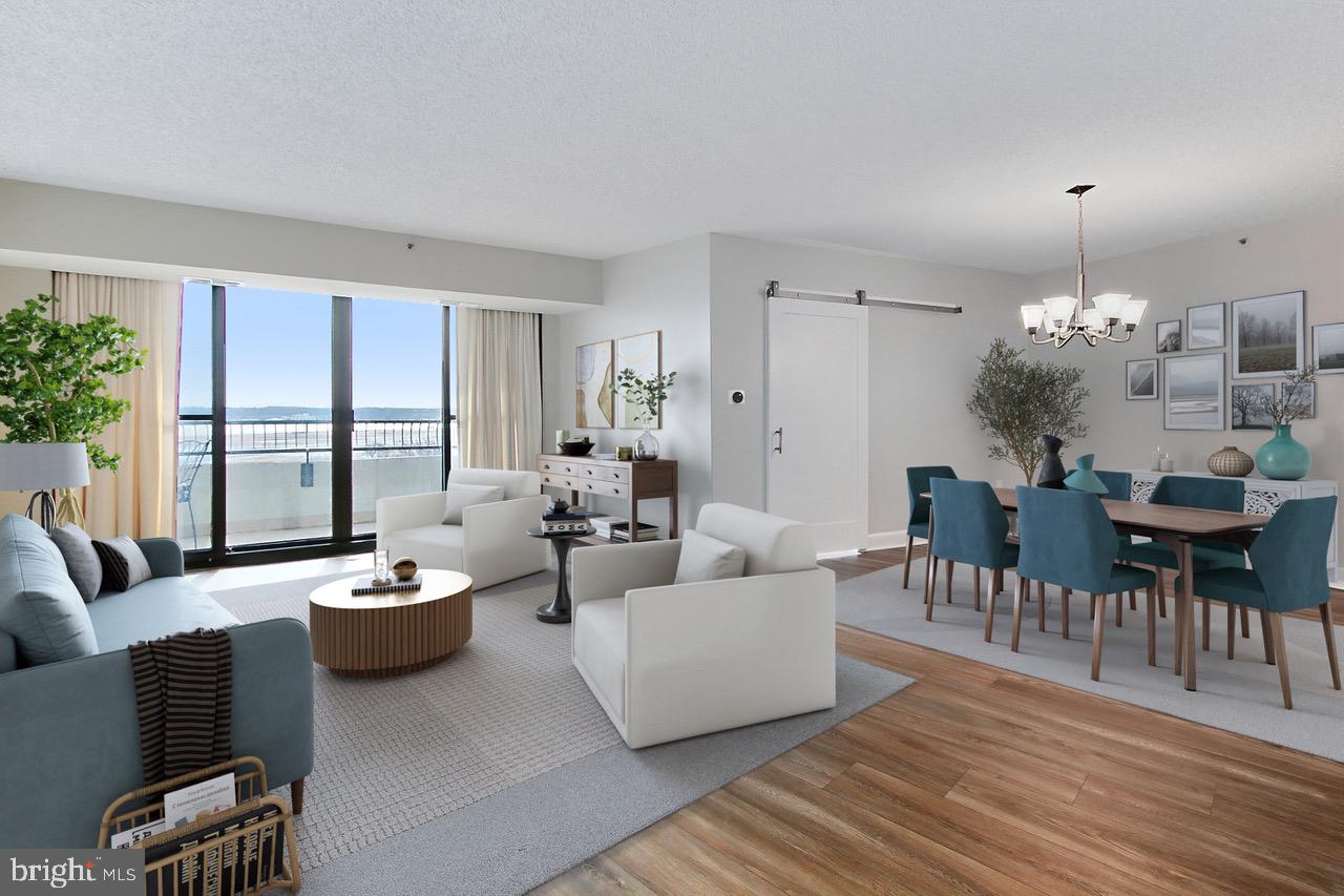 OFFER ACCEPTED, OPEN HOUSE CANCELLED. Called back into the office?  This completely renovated, move-in ready 2 bed, 1 ½ bath condo with a million dollar view is for you!  Enjoy long views across the Potomac to the Tidal Basin, Washington Monument, Jefferson Memorial, and even the fireworks at Nats Park and on the Fourth of July downtown from your expansive private terrace.  Located in a great building in the heart of Crystal City, commuting to the Pentagon, Amazon HQ2 or anywhere in DC is a breeze with direct access to the metro (yellow & blue lines) through the Crystal City Underground.  No expense was spared in this top to bottom 2023 renovation.  The condo is anchored with Karastan wide-plank LVP flooring, the walls are a serene Benjamin Moore Edgecomb Grey, the new doors and trim are a bright, crisp white and the lighting is modern.  Custom curtains adorn the windows for privacy.  The floorplan is open and welcoming blending the dining, living and eat-in spaces.  The kitchen boasts beautiful shaker cabinetry, stainless steel appliances, quartz countertops, a designer tile backsplash and undercabinet lighting.  The spacious primary bedroom features wall-to-wall carpet, a walk-in closet, a second closet and access to the private terrace.  The main spa-like bathroom has an enormous luxury shower with glass enclosure, new cabinetry, toilet, tile flooring, mirrors, lighting and an oversized linen closet.  A second bedroom / den features a stylish barn door and that amazing view from the window.  An updated half bath, full-sized in-unit laundry, one assigned garage parking spot and an assigned storage space complete this fantastic unit. The complex features 24 hour security, an indoor and outdoor pool, fitness center, library and party room.  This prime location allows for a short walk to restaurants, shopping, Long Bridge Park, the Mount Vernon Trailhead and easy commuting via Metro, VRE and Reagan airport.  Welcome Home!  Please note:  Pets are not permitted in the building, except service animals.  Photos are virtually staged.  Active for private showings with your agent on Tuesday, March 11th.