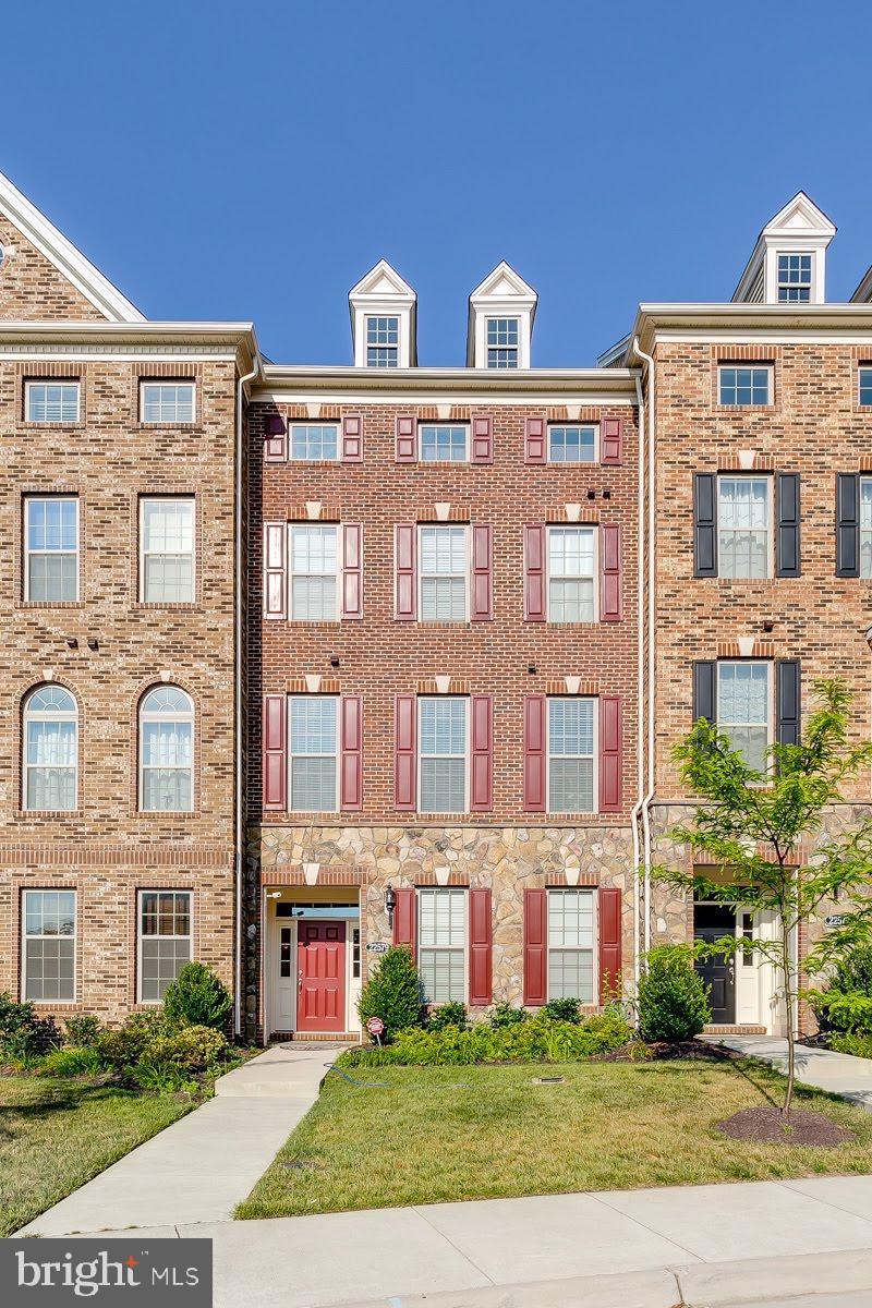 This Moorefield Station townhome offers 4 finished levels including 4 bedrooms/3.5 baths, a huge upper level loft and a 2 car garage.    Parking is generous and guests approach through the covered entry where beyond the foyer you will find a convenient Main Level bed and bath (or use as office space)! At the center of this home is a beautiful kitchen complimented by upgraded cabinetry, granite counters, SS appliances including wall oven, gas cooking, vent hood, ice maker and lovely neutral toned backsplash.   The island offers breakfast bar seating in addition to the separate eat-in table space.  Built in pantry with plenty of cabinet and counter space.   Step outside and enjoy the spacious deck!  Nicely sized bedrooms with bedroom level laundry.  The possibilities seem endless with the large loft where options may include additional guest space, office space, home schooling space, rec room space or even a fitness area – you choose!  This home offers an attached rear 2 car garage with a generous amount of  street parking right out front for guests with a larger parking lot just a stones throw away.
Wonderful community amenities including the Clubhouse, fitness center, community pool and large playground are conveniently located right across the street for easy access.  School bus stop is located in front of Clubhouse.   An excellent location close to major commuting routes, the metro, Dulles airport, Moorefield Station Community Park, shopping, dining and conveniences.  Lawn mowing included with HOA.   **Please note that the projector and screen in the loft images are not in place and would not be included with the property**.  Dogs considered case by case.  No cats please.
Easy online application.