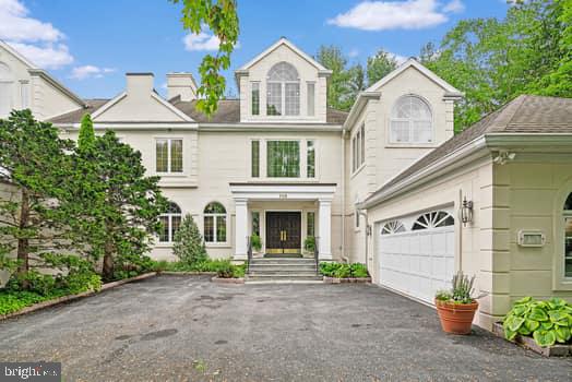 Tucked away at the end of the street in the gated community of Wrenfield, this truly elegant residence has been completely renovated to the highest standards. This stunning home offers 3 bedrooms, 3.5 bathrooms, and an impressive 5158 square feet of living space.  There is an elevator reaching all floors.

Upon entering, you'll be greeted by a sense of refinement and modern elegance, with a soaring two-story foyer and an elevator providing convenient access to all levels of the residence. The chef's kitchen is a masterpiece, featuring top-of-the-line Sub Zero refrigerator and freezer, as well as a Wolf stove/oven. The main living area boasts a gas fireplace, perfect for cozy evenings and seamlessly opens to a large den.  French sliding glass doors to the exterior space seamlessly blending indoor and outdoor living.

*There is a Special Assessment of $5,000.  Please inquire for more information.

The primary suite and separate sitting room has its own balcony overlooking the grounds. The primary bath  is a sumptuous spa retreat, featuring a luxurious tub and a generously sized shower, complemented by a double vanity. This private oasis provides the perfect escape for relaxation and rejuvenation. Two other bedrooms, and a dressing room which could also be a fourth bedroom complete the upstairs.  
The lower level is fully finished with a entertaining area and a hardwood floor space for exercise.  

The expansive lot is adorned with a beautiful gazebo, offering a serene retreat for outdoor relaxation. The meticulously maintained grounds further enhance the property's allure, creating a picturesque setting for outdoor gatherings.

The HOA provides unparalleled services including 24 hour secured gate entry, landscaping, exterior building maintenance, snow and trash removal, and insurance.