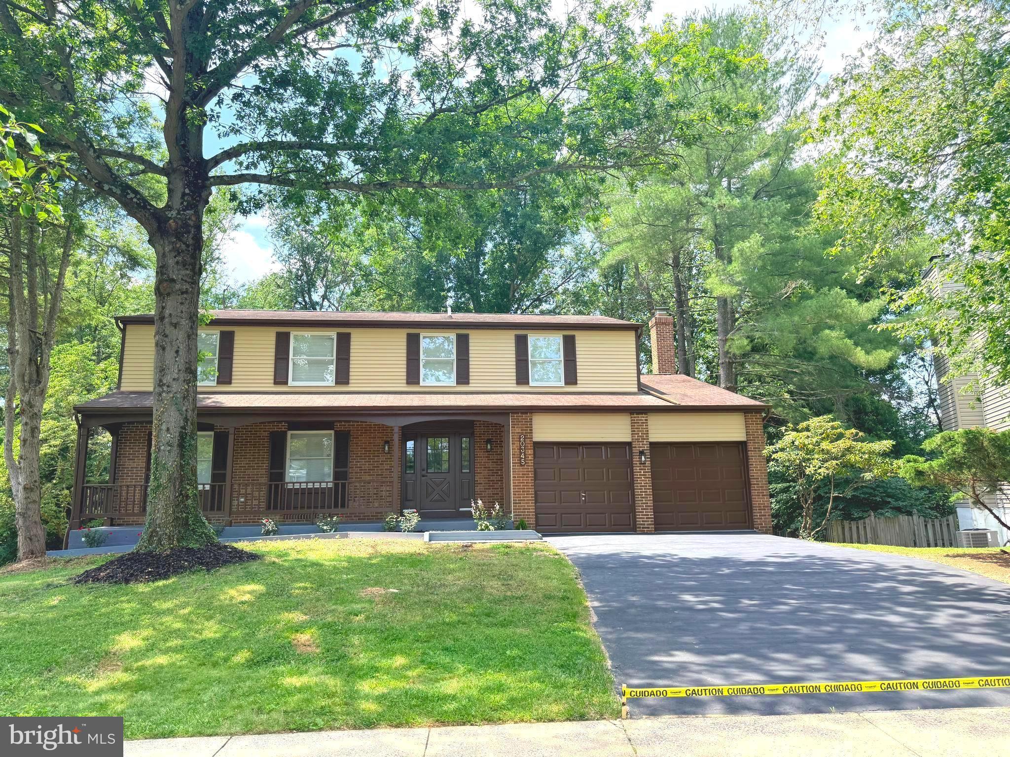 You will love this stunningly remodeled colonial, one of the largest models in Watkins Meadows on a 1/4 acre lot!! As you arrive you are welcomed by a lovely front porch! The first floor features a cozy living room with electric fireplace, a formal dining room with chair rail molding, and a beautiful kitchen, with kitchen island, quartz countertops, stainless steel appliances and all new fixtures and lighting including under cabinet lighting!!  Spacious den off of the kitchen with a wood burning fireplace! And a fully remodeled powder room!The sliding door takes you to a spectacular multi tiered deck that overlooks mature trees. The backyard is so private and serene, perfect for relaxing or entertaining!! On the second floor you will find 5 bedrooms and 2 full baths! The principal bedroom features a dressing area, a walk-in closet and a gorgeous bathroom with a shower! All bedrooms are generously sized! The home has a full, walk out basement that has been tastefully finished! As you go downstairs there is a family room with an electric fireplace for those chilly nights. a full bath, a laundry room with space for storage, and an extra room that can be used as a bedroom, office etc. The floors throughout the house are brand new engineered hardwood and the bathrooms have been beautifully remodeled with gleaming porcelain tiles. There are crown moldings in the living, dining an family rooms with. LED lights (expect for dining room) A two car garage and a big driveway offer plenty of parking!! Enjoy easy access to I-270, MD 355, MARC train and Germantown Town Center, with shops, restaurants and plenty of entertainment!