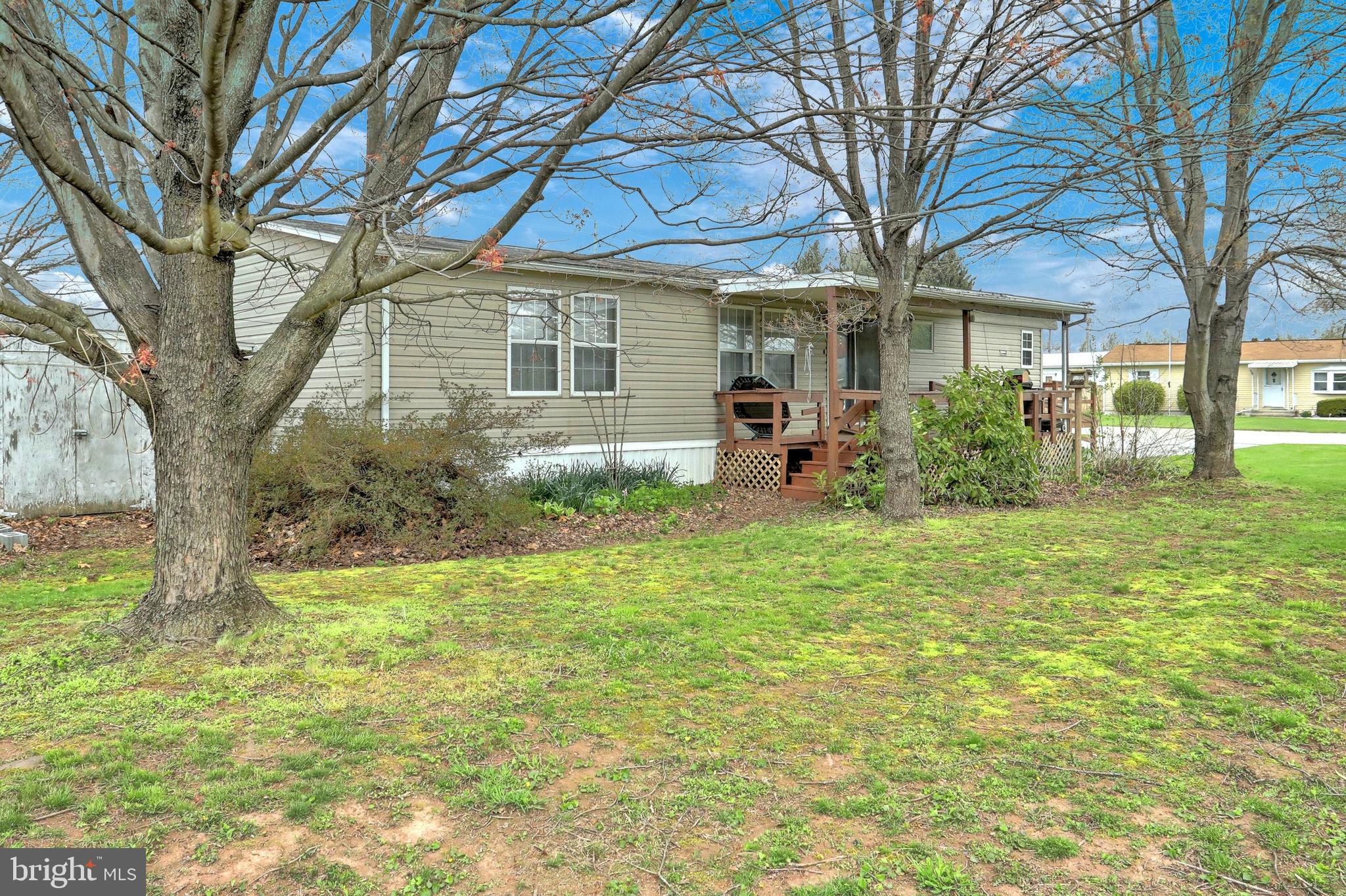 Enjoy the views from the covered porch of this 3 BR / 2 BA home. Lots of room to entertain with both a breakfast area and separate Dining Room. Kitchen has nice flow and lots of storage. Master Bedroom has large window and private bath. Home has ramps for easy access and plenty of parking space. Unlike other parks, these homes have plenty of space between them.