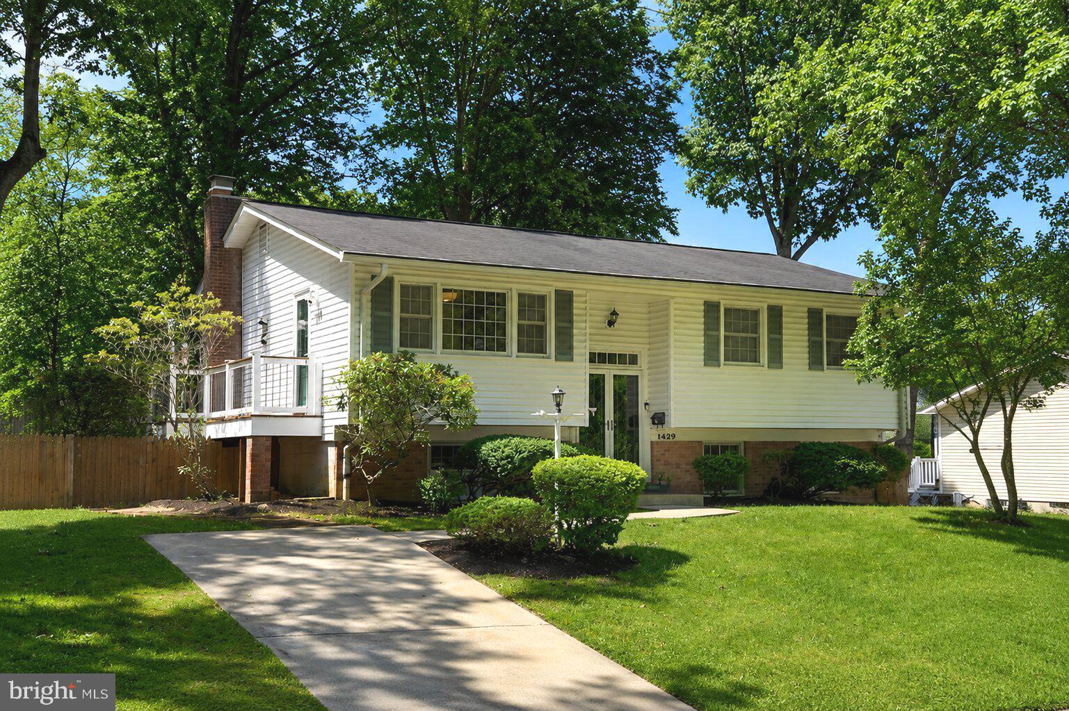 Welcome to 14429 Brad Drive — a picture-perfect home that is more than move-in ready. Thoughtfully designed, beautifully maintained, and filled with natural light, this inviting residence offers an effortless flow from room to room, creating a comfortable backdrop for everyday living and easy entertaining. Recent updates bring a fresh, polished feel throughout, including whole-home painting, a stylish kitchen renovation in 2020, new flooring throughout the lower level, renovations to all three bathrooms, a new hot water heater, and more! 
The main level is anchored by open living and dining spaces, where expansive windows and a sliding glass door to the deck allow natural light to pour in and illuminate the warm hardwood floors. At the heart of the home, the beautifully appointed kitchen is both functional and inviting, featuring custom green cabinetry, quartz countertops, stainless steel appliances, and a cozy built-in banquet dining area. Whether hosting intimate dinners or larger gatherings, the kitchen’s connection to the adjoining living spaces creates an atmosphere that feels both elevated and comfortable.
The bedroom wing is tucked off the main living area and includes three bedrooms and two full bathrooms. The primary suite features a completely renovated ensuite bath with stylish blue tile and a custom glass sliding door. The secondary bathroom has also been refreshed with a new vanity, while a large linen closet provides generous additional storage.
The lower level expands the home’s livability with flexible finished space ideal for recreation, fitness, media, guests, or casual evenings with friends. This level also includes the fourth bedroom, a third full bathroom, new flooring, and laundry located in a spacious storage room.
Outside, the backyard offers a peaceful extension of the home, complete with a wraparound deck and a path leading to the front of the property. The deck is perfect for dining al fresco, entertaining guests, or simply unwinding at the end of the day.
Located in the Aspen Hill area of Rockville, 14429 Brad Drive offers the perfect blend of neighborhood tranquility and everyday convenience. Enjoy close proximity to local shopping, dining, parks, and community amenities, with nearby access to Aspen Hill Local Park, Matthew Henson Trail, and Rock Creek’s scenic outdoor spaces. Commuters will appreciate convenient connections to Georgia Avenue, Norbeck Road, Veirs Mill Road, the ICC, I-270, and nearby Metro and MARC options, placing Rockville, Olney, Silver Spring, and greater Montgomery County within easy reach.