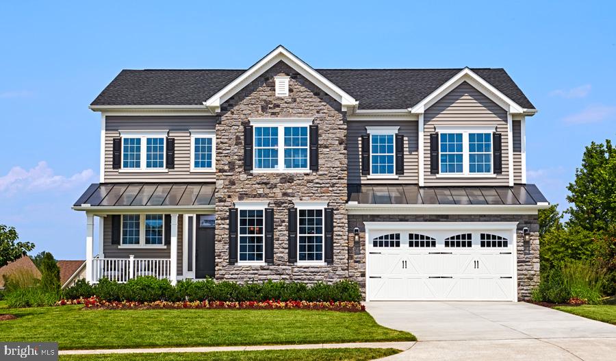 Quick-Move in with special financing available! Only 5 homes remaining! This eye-catching model home makes a dramatic impression, starting with a covered porch, an airy two-story entry and 9' ceilings. The front of the home features a private study with French doors and a 2-car garage with a shop. At the back, an open layout makes for easy entertaining: Gather in the gourmet kitchen with quartz countertops, a double oven, a center island and stainless-steel appliances, or in the cozy great room with an electric tile fireplace. You’ll also enjoy a sunroom and covered deck. Upstairs, discover a deluxe laundry room, three generous bedrooms and a shared bath, plus a lavish primary suite with tray ceilings, an immense walk-in closet and a deluxe bath with a frameless shower door. A finished basement with a bedroom, a bathroom and rec room with wet bar is also included. Additional highlights include a mudroom with key drop, open oak stairs and luxury vinyl flooring.