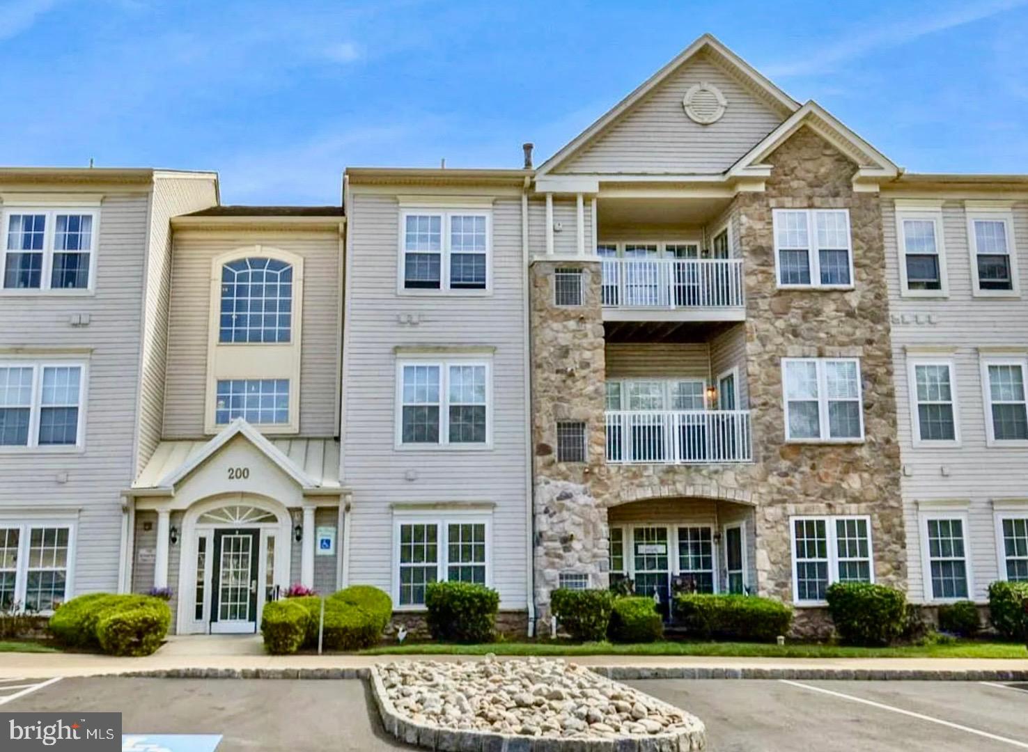 Welcome to the sought after 55+ Community of Forest Ridge located in Warrington Township. Forest Ridge is impeccably maintained, visually pleasing, and situated near all the wonderful shopping Warrington has to offer. Check out the interior of this unit! You can access this unit through a security door in the main lobby and choose between the elevator or the stairs. Many designer updates have been made including a carefully selected paint palette, recessed lighting in the kitchen and living room, ceiling fans in the bedrooms, updated lighting in the sunroom, and new bedroom carpeting. 9' high ceilings accented by crown mouldings. Engineered hardwoods really make the living room, dining room, and kitchen stand out along with the abundance of windows which were fit with custom window treatments!  The kitchen is in like new condition! Corian countertops, matching appliances, an oversized kitchen sink, and is open to the living room. The kitchen also houses a pantry and a second closet for the washer and dryer. Terrifically layed out with bedrooms on either side of the home and bright and airy living spaces in all rooms. All up to date on the recently serviced HVAC system! The main bedroom is sunny and includes 2 closets with one being a walk-in closet. Inclusive to the main bedroom is a full main bath with a newer walk in shower. The second bedroom is wonderfully sized and equipped with a closet and access to the hall bath. You can appreciate the amount of closet space found in this home including the oversized walk-in foyer closet. If you enjoy going on walks for your daily stroll, a walking trail can be found on the left side of the community. What a wonderful place to call home!