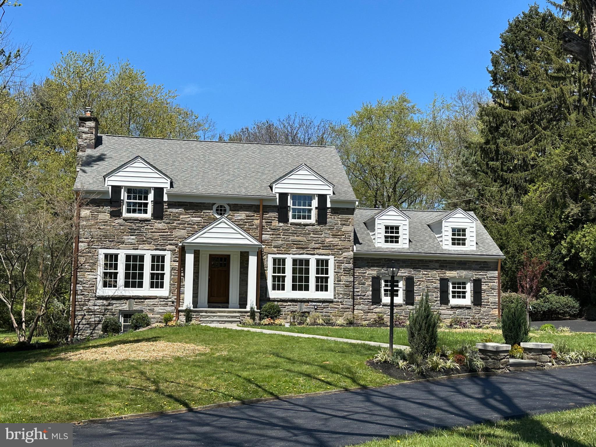 Beaupre neighborhood of Radnor renovation of solid stone home on a flat 0.95 acre. which can accommodate at pool if desired.   The welcoming front flagstone walkway brings you to the the entrance of this stone home which is a rebuild out / renovation from the reworking of the first floor plan.  Refinished hardwood floors thru out, a moderately finished basement amongst many other items allows you immediate enjoyment. The first level includes large mud room with cubbies, built in pantry and extra large laundry area with quartzite countertops, new powder room and entry to back flagstone roofed patio with fenced yard with enough space to add a detached garage or pool.  The large gourmet custom cabinet  kitchen includes an expansive quartzite island that seats 5+ with waterfall edge,  an eating area that has sunroom windows, and beverage bar. There is an adjacent mid level room off the kitchen is an opportunity for in law suite or quiet work from home office.  The second floor houses a large master suite with his and her custom built closets, all new bathroom with generous counter space and sunlight, and a walk up attic. Two of the bedrooms on this floor are large with custom closets and  a hall bath . The other  bedroom has an ensuite bathroom.  There is a very private mid level room off of the kitchen which can serve as a 5th bedroom, in home office or au pair suite. Level expansive rear yard. Award-Winning Radnor Township Schools and easy access to Philadelphia, New York or Harrisburg via I476 & PA turnpike. Septa R5/Amtrak station within 10 minutes.