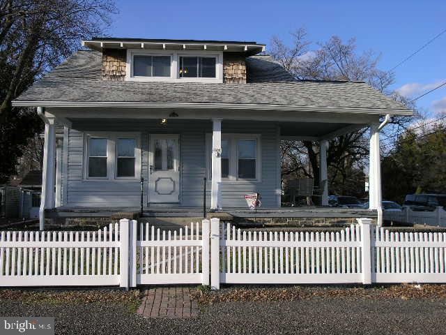 Welcome to 1208 Camac Street, Bensalem, PA 19020 – your charming Cape Cod retreat in the suburbs!
Step into this clean and updated home with a detached oversized 2-car garage, nestled on a beautiful corner lot with a classic white picket fence.
As you approach, the covered porch entrance with storm and steel front doors sets the tone for the inviting atmosphere inside. The formal living room boasts wall-to-wall carpeting and wide painted baseboards, creating a cozy space for relaxation. The adjacent formal dining room, adorned with hardwood flooring, continues the elegant theme, complete with a ceiling fan.
The kitchen is a culinary haven with gas cooking, a gas stove/oven combination, and ample wood cabinetry. The breakfast room, currently used as a pantry, features charming built-ins.
Two ample-sized bedrooms on the main level provide comfort with wall-to-wall carpeting, ceiling fans, and stylish wide painted baseboards and trim. The full ceramic-tiled hall bathroom showcases a newer vanity, commode, and fixtures.
The second floor offers versatility, currently used as a 2-bedroom layout with a den area. This space can easily be transformed into an oversized main bedroom or customized to suit your needs. Wall-to-wall carpeting, ceiling fans, and ample closet spaces add to the appeal.
The basement/laundry area includes washer/dryer hookups, a full laundry tub, gas hot water heater, hot water tank, and a heat pump A/C. The upgraded 200 amp C/B service and storage space enhance the functionality of this home.
Outside, an oversized 2-car garage with an opener, stone drive, and double gate entry await. The left side of the property features a stone drive and a double gate entry. Newer roofing, windows, and solar panels (new owner would need a provider for solar use) contribute to the overall value of this property.
Conveniently located near major roadways and transportation, this home is within walking distance to most shopping destinations.
Don't miss the opportunity to make this delightful Cape Cod your own!