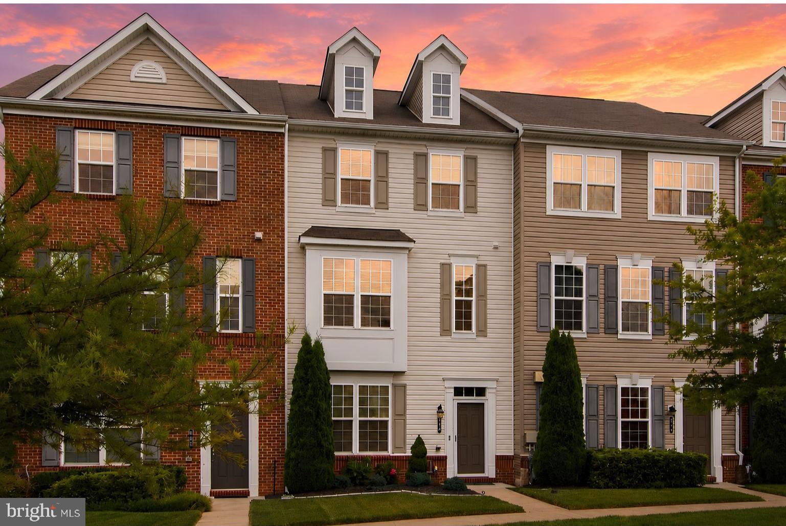 Welcome to Quarry Place! This beautifully maintained townhome offers three finished levels, an open-concept layout, and stylish upgrades throughout. The main level features 9-foot ceilings, hardwood floors, abundant natural light, and a gourmet kitchen with an oversized 8-foot island, granite countertops, and stainless steel appliances. Enjoy peaceful lake and tree views from the private deck. Upstairs, you'll find a spacious primary suite, two additional bedrooms, a full bath, and convenient laundry. Community amenities include walking trails, a dog park, and beautifully landscaped common areas, all just minutes from shopping, dining, and commuter routes.