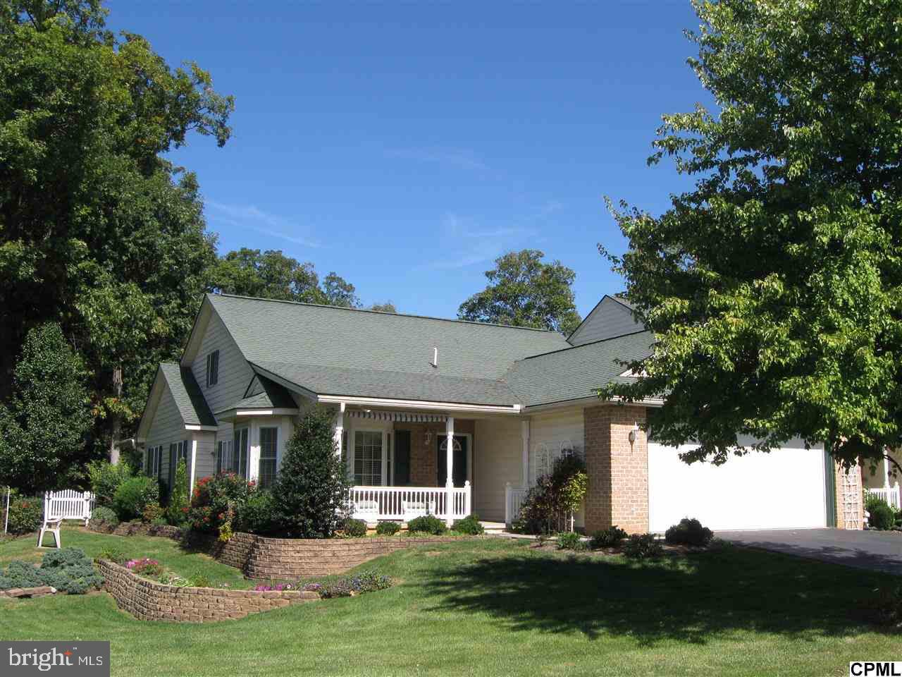 Well cared for end unit 1.5 story townhome. Fully landscaped corner lot. Formal LR, DR, eat-in-kitchen, Den,2 BR,2 BTH remodeled in 2011 totally handicap accessible. Laundry Room. Recent upgrades: Solid kitchen countertops, carpet & Dura-ceramic flooring. Covered rear patio w/exterior ceramic flr. 2-car garage w/work bench & cabinets. Walk up 2nd level storage,could be finished for 3rd BR. Additional .5 Acre rear wooded lot.