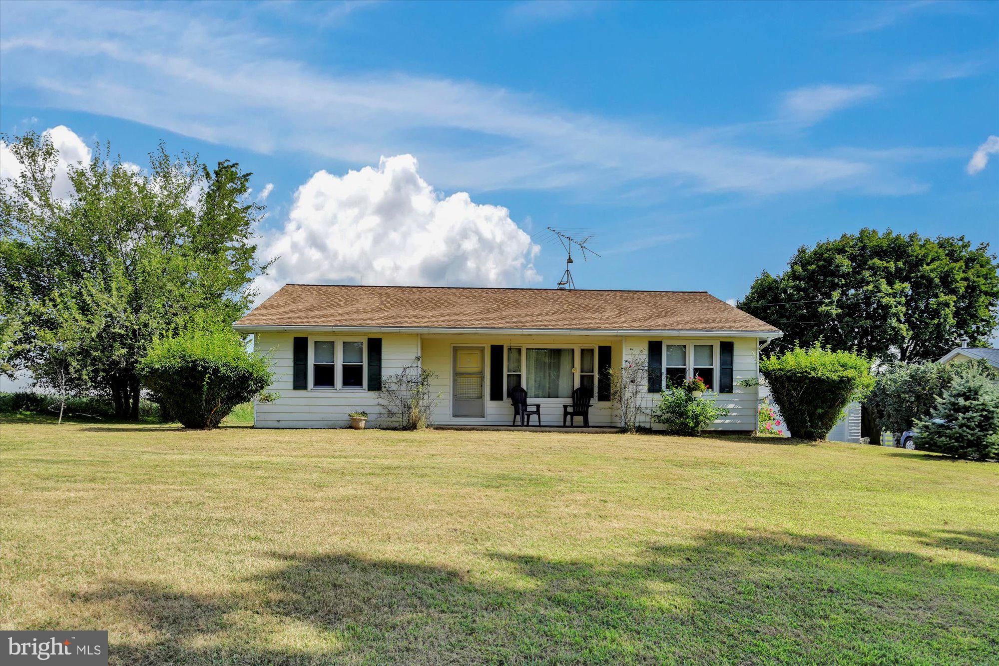 Country rancher with a 2 car detached garage, just minutes from Rt 1. Completed updates include roof (2013) PVC plumbing, newer 200 amp electric  panel, replacement windows and stainless kitchen appliances which stay with the home. Ceiling fans throughout. Laundry was moved to a closet in bedroom 3 by seller, but can easily be relocated back to the lower level, which has hookups. Washer, dryer & 2 window AC units are included also.