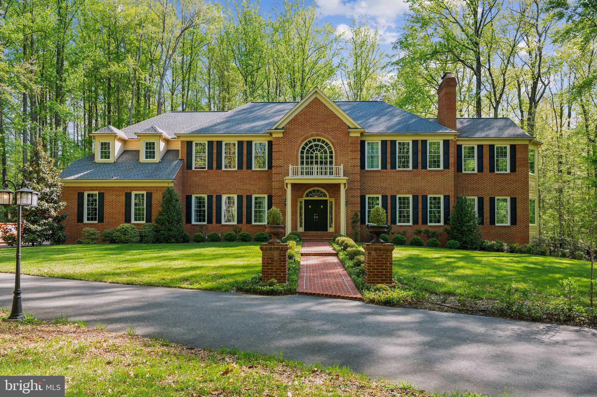 ****Seller is open to back up offers**** has a VA assumable loan with a 2.25% interest rate, a remaining balance of just over $1,300,000, and approximately 26 years left on the term. Buyer must qualify with the current lender for assumption.*****

Premium estate on over five private acres in the prestigious Enclave at Havenwood, formerly the model home for this exclusive community. Offering nearly 10,000 square feet of refined living space, this turn-key residence combines quiet country privacy with resort-style living. A long, widened driveway leads to a grand brick entry with stately hardscaping, wrought iron lanterns, and professional landscaping that enhances the curb appeal. Inside, a dramatic two-story foyer and soaring 11 to 14-foot ceilings welcome you, with solid oak hardwood floors, silent floor construction, and oversized windows that flood the home with natural light. The main level features spacious, open-concept living and entertaining areas, multiple fireplaces including three remote-controlled gas fireplaces and two electric fireplaces in the primary suite and bath, and elegant finishes throughout.
The heart of the home opens seamlessly to a screened porch pavilion overlooking the peaceful backyard, ideal for indoor-outdoor living. Just beyond, a custom in-ground saltwater pool with gas heat, travertine decking, a tanning ledge, and an automatic cover provides the ultimate private escape. The property also includes four garage bays, highlighted by a recently constructed two-story detached garage with an upper-level workshop—perfect for hobbies, storage, or a private office space. Additional upgrades include a six-zone in-ground irrigation system, integrated landscape lighting, a new formal estate landscape and hardscape design, and a new brick retaining wall that expands the parking area.

Upstairs, the home offers four generously sized bedrooms including a luxurious primary suite with a sitting area, a spacious walk-in closet, and a beautifully updated bath. A second-floor laundry room was added for convenience. Recent major system updates include a 50-year architectural roof, top-of-the-line Carrier HVAC system, and energy-efficient windows with a lifetime warranty—all installed approximately five years ago and still in excellent condition. Designer lighting, oil-rubbed bronze fixtures, and handcrafted barn-style doors in the open basement showcase the thoughtful upgrades throughout. With trails, wooded acreage for exploration, and privacy that’s hard to find, this home is both an escape and an entertainer’s dream. Located just one stop sign away from Paradise Springs Winery and a short drive to the historic town of Clifton, with dining options like Trummer’s, Villagio, and Clifton Café & Crêperie, this is an extraordinary opportunity to own one of the finest homes in Northern Virginia.