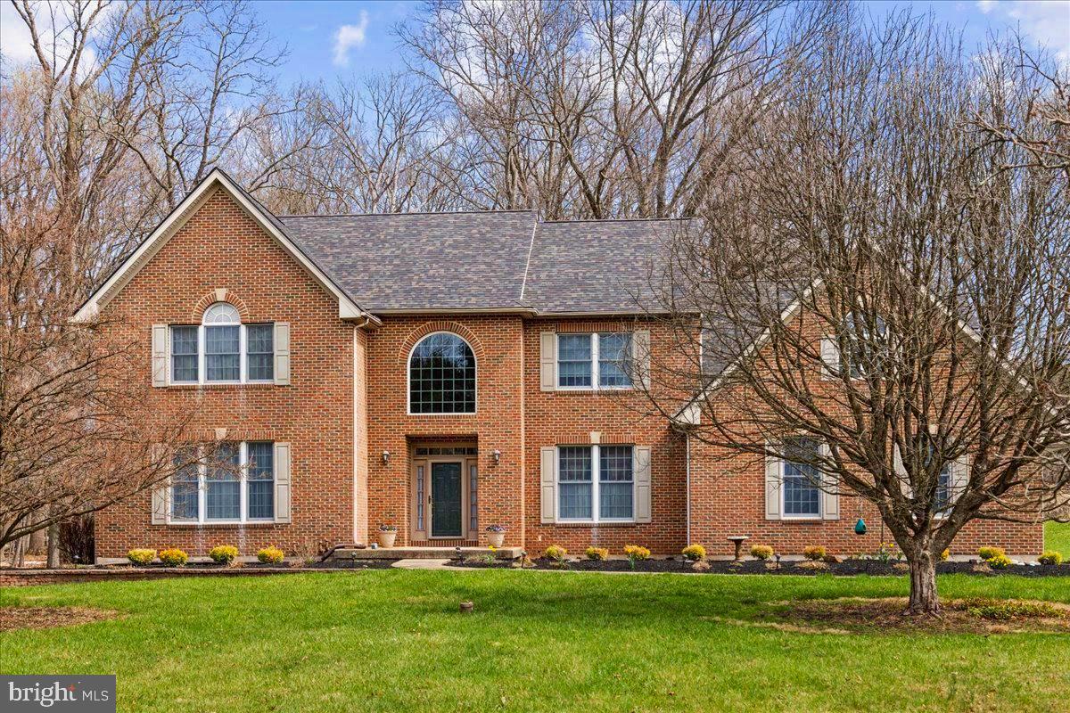 Debuting on the market for the very first time on a secluded 4-acre property, is a meticulously custom-designed brick colonial situated on the highly sought-after Middleton Lane. This generously proportioned 5 bedroom, 3.5 bath dwelling spans over an impressive 4,618 square feet of premium living space that has been impeccably preserved.  Inside, you'll find the interiors to be a blank canvas of flexible space, presenting a harmonious blend of an open concept kitchen and family room, further enhanced by the elegance of hardwood flooring throughout. The kitchen, tastefully updated not too long ago, boasts stainless steel appliances, fine cherry hardwood cabinetry, and a wine refrigerator stylishly embedded in the center island. In the warmer seasons, imagine stepping out onto your personal deck, conveniently accessible from the kitchen, and indulging in the calm and beauty of tranquil mornings in a picturesque landscape. The family room exudes comfort and warmth with the delightful touch of a brick wood-burning fireplace, perfect for unwinding. The first floor also includes an extra living room ideal for entertaining, a formal dining room, laundry room, and direct access to the 3 car garage. Exceptionally energy-efficient, this home has been outfitted with spray foam insulation and utilizes geothermal heating. Not to be overlooked, this property also features an in-law suite complete with its own exclusive stairwell, comprising a bedroom, full bathroom, ample closet space, and a multi-use living or office area. The upper level is rounded off with two guest bedrooms and a spacious en-suite primary bedroom complete with a walk-in closet, all bathed in abundant natural light. The expansive basement, currently used for incredible storage, eagerly awaits your personal finishes, and if more space is needed, the fully floored attic makes storage a breeze. This graceful residence, with its classic brick facade, new roof and alluring landscaping, sets an idyllic stage for creating priceless memories for years to come. Located conveniently close to unique shopping, entertainment, parks, restaurants, and situated within the highly regarded New Hope Solebury school district, this property promises an unparalleled living experience. Middleton Lane, renowned for its spacious lots and serene surroundings, offers a peaceful and high-quality lifestyle to its cherished residents. This is a seldom-seen opportunity, as turnover is infrequent, ensuring a sense of comfort with a home that promises a wonderful future.
