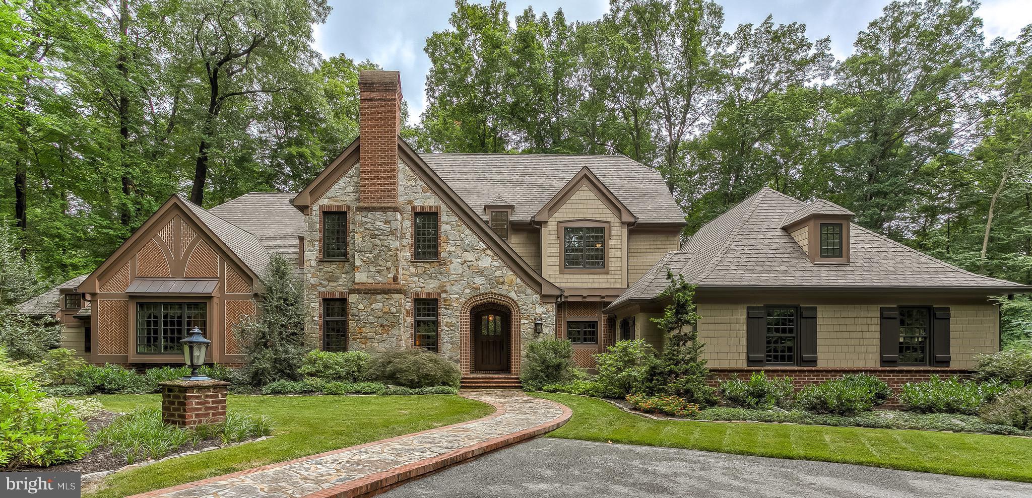 An enduring lifestyle choice in coveted locale. Tree-lined welcome that reveals outstanding country estate resting on 10+/- ac of natural splendor and miles of trails. Stunning Walter Daniels design elevates your daily existence. Salivate over signature Benhoff millwork, craftsmanship & finishes. Every design detail was carefully selected and quality crafted to create warm & inviting family spaces with an elegant yet casual feel. Inspiring Butler stone and Cushwa brick with Herringbone accents highlight the stately exterior. Brick archway with over-sized wood entry door lead guests into a foyer and expansive Great Room with soaring two-story ceilings with exposed beam framing which carries over to the awe inspiring Chef s kitchen. John Canatellie design-build provides five cooking areas with three sinks, SubZero side by side refrigerator, Wolfe gas range & stove, additional KitchenAid oven, two Miele dishwashers, granite counters & Italian tile backsplash and inlaid cabinets. Revel in the tranquility of the Four Season room offering well curated use of bluestone, shiplap siding, tongue & groove ceiling, Butler Stone fireplace and custom BBQ with built-in Wolfe grille, hooded exhaust and granite prep area. Endless lifestyle options include sophisticated main-level master suite, a spa-like master bath with Kohler soaking tub & walk-in tile shower with Body Jets, dreamy master closet with center isle vanity, private elevator, expansive main level laundry, three stately en-suite bedrooms, wine cellar with tasting area, 2-car heated main garage and additional 2-car collectors garage. Functional, elegant and exquisitely crafted with stunning custom finishes - this 5,911 sf masterpiece (2013) exhibits an impeccable flow and seamless blending of indoor and outdoor spaces. Nestled in the serenity of My Lady's Manor & Hereford Zone schools and only minutes to Wegmans, Manor Tavern & I -83.