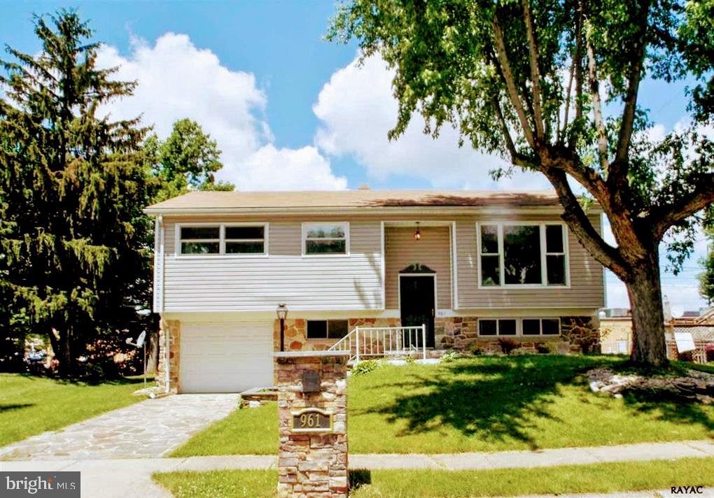 Talk About Home Sweet Home! This Adorable Split Level Home Has Been Completely Renovated and is Move In Ready! Upper Level Features a Huge Living Room Open to Dining Room with Large Deck Access, Gourmet Kitchen Including Stainless Steel Gas Range, Microwave, Dishwaser, & Refrigerator, Three Bedrooms and Fully Remodeled Full Bath, Lower Level Features Family Room with Stone Fireplace & Rear Stone Patio & Yard Access, Fourth Bedroom, Half Bath, Workshop, Laundry Including Washer Dryer, Mechanical Room, One Car Garage and Landscaped Front & Rear Yard. Schedule a Showing Today !