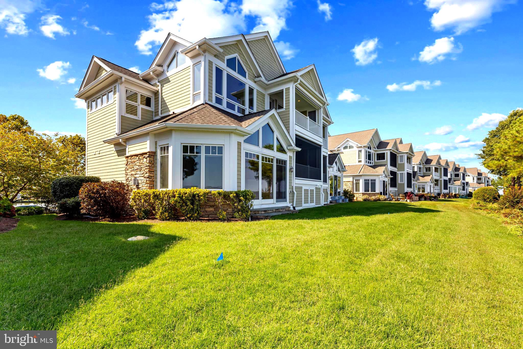 REDUCED PRICE !  Experience Exceptional Waterfront Living on the Chester River!  A stunning 3000 sq ft townhome featuring 3 bedrooms, 3.5 bathrooms, a dedicated office AND a large bonus room - offering the perfect combination of comfort and flexibility.  This was also one of the few "stretch" units- built wider to accommodate setbacks.   The result was a wider Dining Room adding more natural light,  wider decks, and more WATERVIEWS!   Inside you'll find an open floor plan that's perfect for entertaining!  It has  hardwood floors,  a dramatic floor to ceiling stone fireplace,  a gourmet kitchen with high end newer stainless steel appliances & finishes, granite countertops, and ensuite bathrooms in all the bedrooms!  Enjoy Beautiful Water Views from nearly every room thanks to thoughtfully designed architectural windows.  Two covered decks with remote controlled screens invite you to relax and take in the breathtaking views over the Chester River. You also have a 2 car attached garage!  Located in an exclusive gated community on a private peninsula, this home backs up to the renowned Safe Harbor Marina that offers a pool, fitness center, and over 600 slips, making it a boaters dream!  Narrows Pointe is just around the corner from many great ( docking) restaurants, tiki bars, coffee and dessert spots!  Golf enthusiasts will love being just 5 minutes from Queenstown Golf Links, close to other courses too!  Outlet shopping is nearby for convenience.  Only 20 minutes from Annapolis and Easton, 45 minutes from BWI Airport, 55 minutes from Washington, DC & Baltimore, and 1 1/2 hours away from Ocean City !  Whether you're looking for a year-round residence or a weekend retreat, this home offers the ultimate Chesapeake Bay lifestyle !