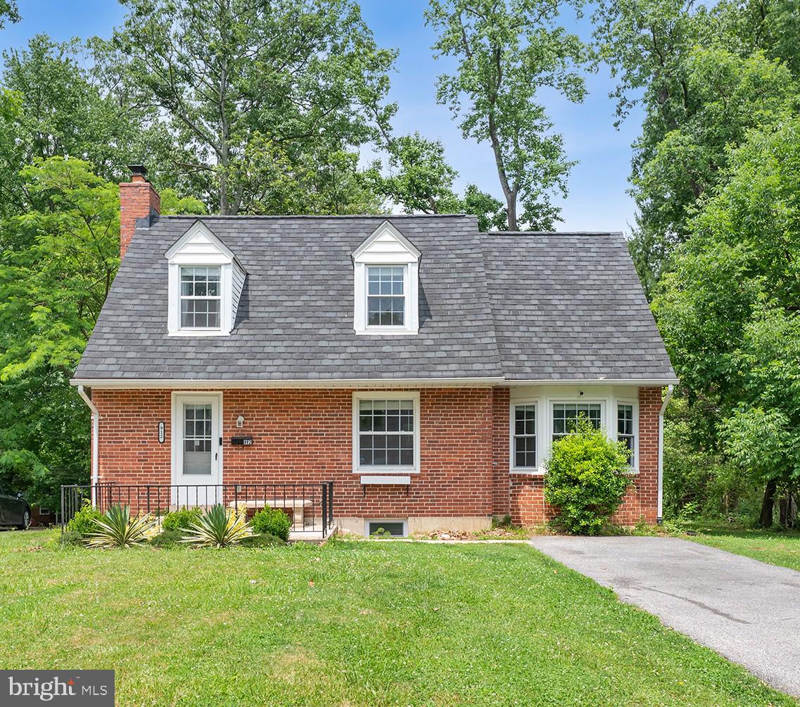 Full of charm and thoughtfully renovated throughout in 2021, 912 Adana Road maintains the character that makes this home and neighborhood so special while putting homeowners at ease with major updates already completed. This brick Cape Cod offers 3 bedrooms and 2 full bathrooms with a versatile layout and prime location designed to accommodate a variety of lifestyles. Step inside to a warm and welcoming living room centered around a cozy wood-burning fireplace. Just beyond, the centrally located kitchen is equipped with Frigidaire stainless steel appliances, quartz countertops and direct access to the finished basement and rear deck overlooking the backyard. A rare feature for the neighborhood, this property offers additional finished living space on the main level created through a former garage conversion. Complete with a private entrance and full bathroom featuring a tiled shower, this flexible area can serve a variety of needs, including a home office, entertainment room, guest space or potential primary suite. Upstairs, you’ll find three generously sized carpeted bedrooms and a full bathroom with a tiled tub and shower combination. The finished lower level provides valuable living and storage space, along with the laundry and utility area. Outside, enjoy a two-tiered deck overlooking the private, level backyard framed by mature trees. This space includes a fire pit area and storage shed, offering the perfect setting for entertaining, relaxing or enjoying the peaceful surroundings. The long driveway adds everyday convenience for homeowners and guests alike. Recent updates completed in 2021 include new flooring, fresh paint, recessed lighting throughout, new appliances, updated bathrooms, updated HVAC and a new roof, creating a true turn-key property for its new owners!