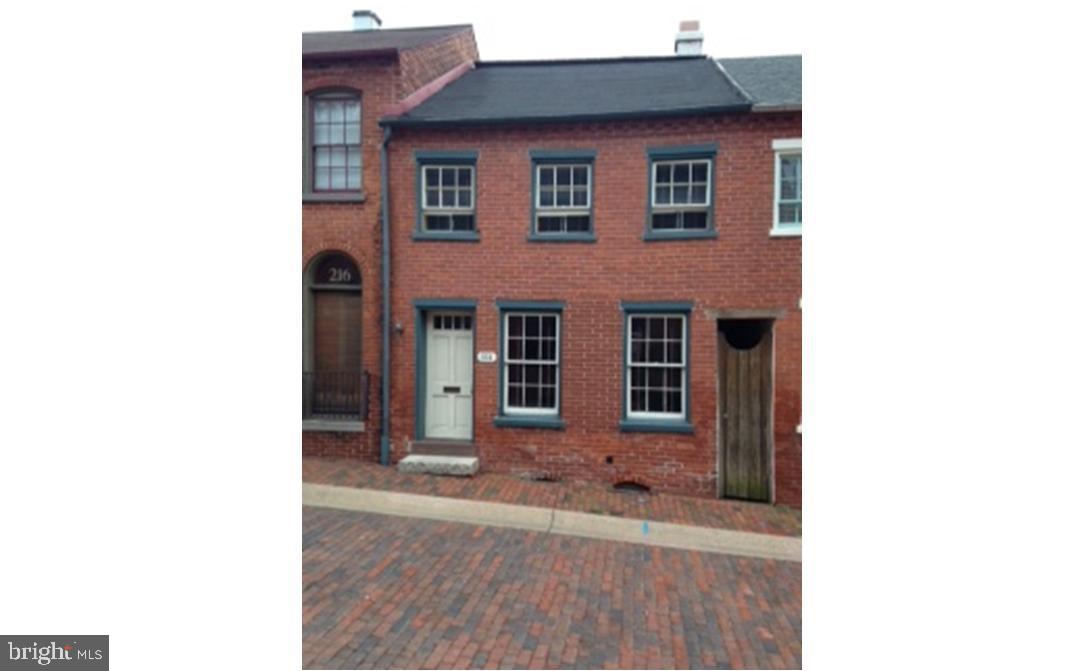 Home nestled in historic neighborhood. Bring it back to its charming potential! Exposed brick, garage, hardwood floors, roof-top deck... Two Blocks from City Square. Location, Location, Location...