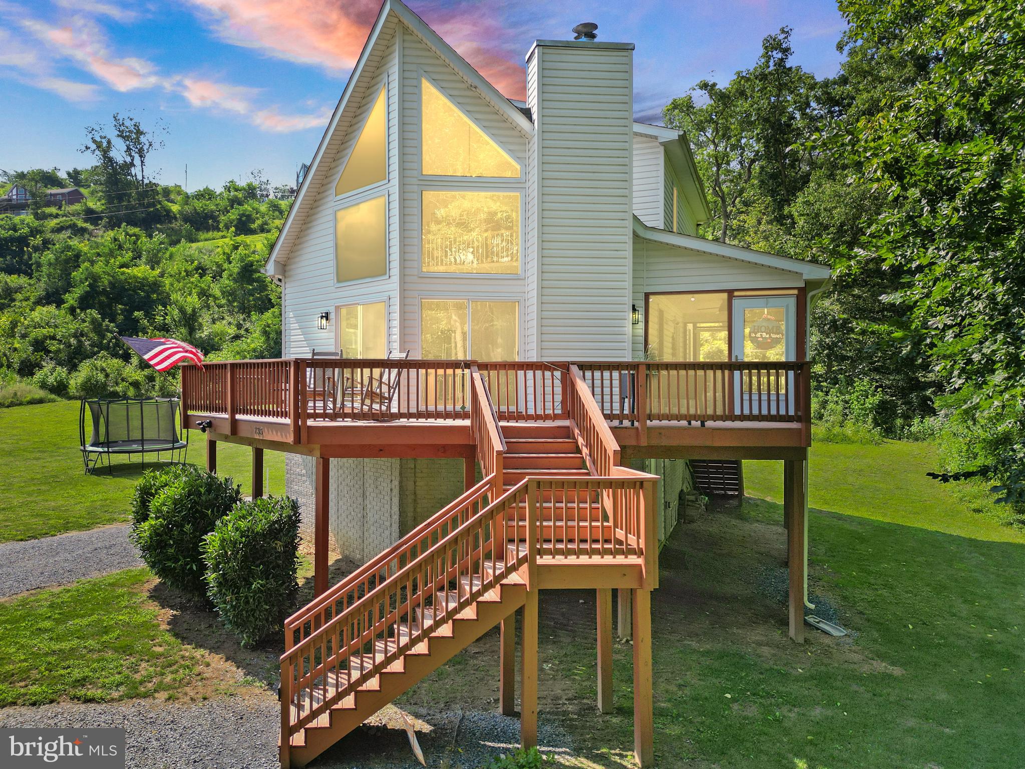 735 Sunset Village Road, Front Royal, VA

**Luxury Riverfront Chalet with Private Shenandoah River Access | 4 Lots Included | Assumable VA Loan**

Welcome to one of the Shenandoah Valley's most unique offerings—a stunning custom-built chalet completed in 2022, perfectly positioned above the Shenandoah River with breathtaking mountain and water views. This exceptional property includes **four parcels sold together**, featuring **three additional riverfront recreational lots with direct river access**, creating a rare opportunity for privacy, recreation, and long-term value.

Tucked away at the end of a quiet road with no through traffic, this modern retreat offers the perfect balance of luxury, tranquility, and convenience just minutes from downtown Front Royal.

Inside, soaring windows fill the open-concept great room with natural light while showcasing spectacular river views. The inviting living area centers around a cozy fireplace and flows seamlessly into the dining area and beautifully appointed kitchen. Designed for both entertaining and everyday living, the kitchen features stainless steel appliances, abundant counter space, modern finishes, and a large breakfast bar.

The spacious floor plan offers four bedrooms, including a luxurious primary suite complete with a spa-inspired bath and oversized walk-in closet. A second-level loft overlooks the great room and captures stunning river views, creating the perfect space for a home office, library, classroom, or additional lounge area.

Step outside and experience what makes this property truly extraordinary. The expansive deck and screened porch provide the ideal setting for morning coffee, outdoor dining, and unforgettable sunsets over the river. The fenced yard offers plenty of room for pets, gardening, recreation, and gatherings around a firepit. Just beyond, enjoy direct access to the Shenandoah River for tubing, kayaking, fishing, or simply relaxing along the water's edge.

The three additional riverfront lots are included, add significant value and are not reflected in most online estimates. Not only do they provide direct river access, but they also enhance privacy and protect the natural beauty surrounding the home. Riverfront land is increasingly difficult to find—and they aren't making any more of it.

Outdoor enthusiasts will love the proximity to Skyline Drive, Shenandoah National Park, Shenandoah River State Park, hiking trails, wineries, caverns, and endless recreational opportunities. Plus, you're only minutes from Front Royal's famous Spelunker's restaurant and just a short drive to shopping, dining, and commuter routes.

Whether you're searching for a full-time residence, luxury mountain getaway, or highly desirable short-term rental investment, this property delivers an exceptional lifestyle in one of Virginia's most scenic locations.

**Additional Highlights: **

* Built in 2022
* Four lots included in sale
* Three additional riverfront recreational lots with direct river access
* Assumable VA loan available
* Offered mostly furnished
* Private end-of-road location
* Strong vacation rental potential
* Flood insurance approximately $1,000 annually (per seller)
* Main living area elevated above garage/basement level

Opportunities like this rarely come to market. Schedule your private tour today and experience the beauty, privacy, and investment potential of this remarkable Shenandoah River retreat.