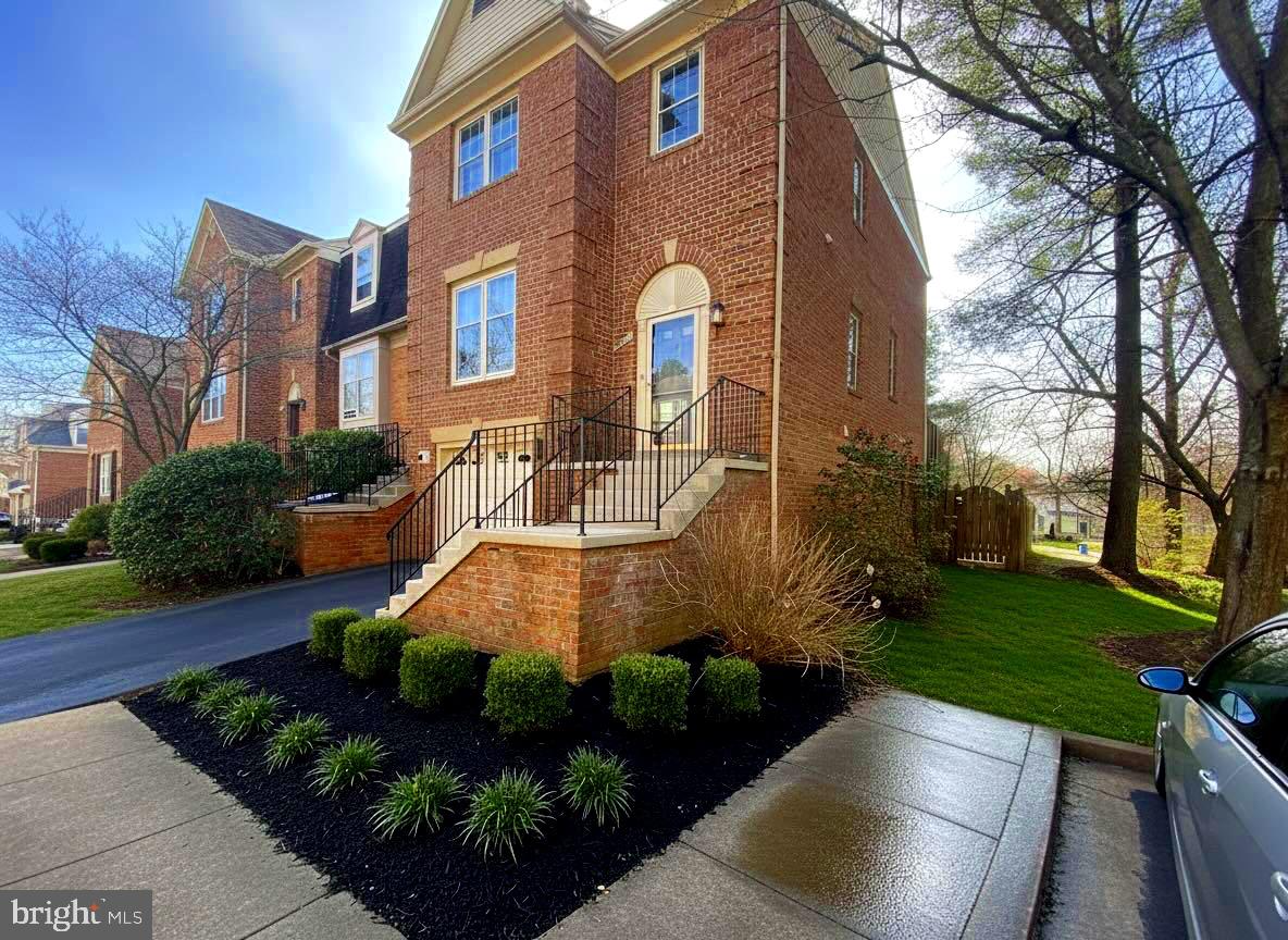WOW...BEST LOT HERE, OPENS TO (OVERLOOKS)  PRIVATE ACRE WOODLAND. RARE FOR  A TOWNHOME!  Bright GARAGE END UNIT  brick federal front in most prime lot with views of MAJESTIC TREES of common "nature" area all around!   You wont find as unique setting in this neighborhood.  No  view obstructions and adjacent to guest parking.  Desirable rear kitchen redesigned offering center island, glass cupboards with workstation.,  French doors out to deck ideal for BBQ with steps to fenced in yard.  Random width oak hardwoods on main level with deep rich moldings and recessed lights.  New carpet and paint.   Huge master with renovated en suite bath with separate tub and shower and walk in closet.  Bright lower level to recreation room with built ins, cherry oak flooring, recessed lights and wood burning fireplace fitted with gas logs.  Sliders to stamped concrete patio with path to side.  This lot is larger than most. One of few Bethesda neighborhoods that feeds in Churchill cluster.  Centralized location with direct access to 495/270, across street from Westfleid Montgomery Mall shopping, adjacent to Bethesda Country Club, ....Act now wont last!