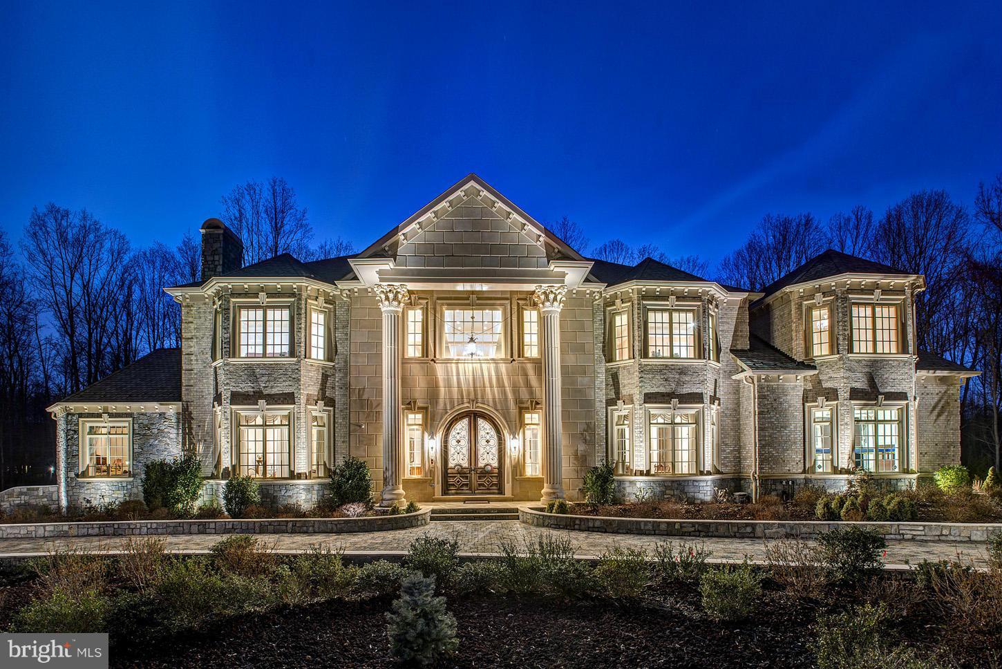 Luxury abounds in this magnificent offering on 2 gated & wooded acres.   Offering a stunning 2-story foyer & grande room,  gourmet chefs  kitchen w/ en suite breakfast area & family room, luxurious master suite w/ private balcony, 6 fireplaces, elevator, home theater, fitness/steam/sauna room, music room, oak & marble floors throughout, Sec. System w/ 9 cameras, &3-port garage w/ 5-car parking!