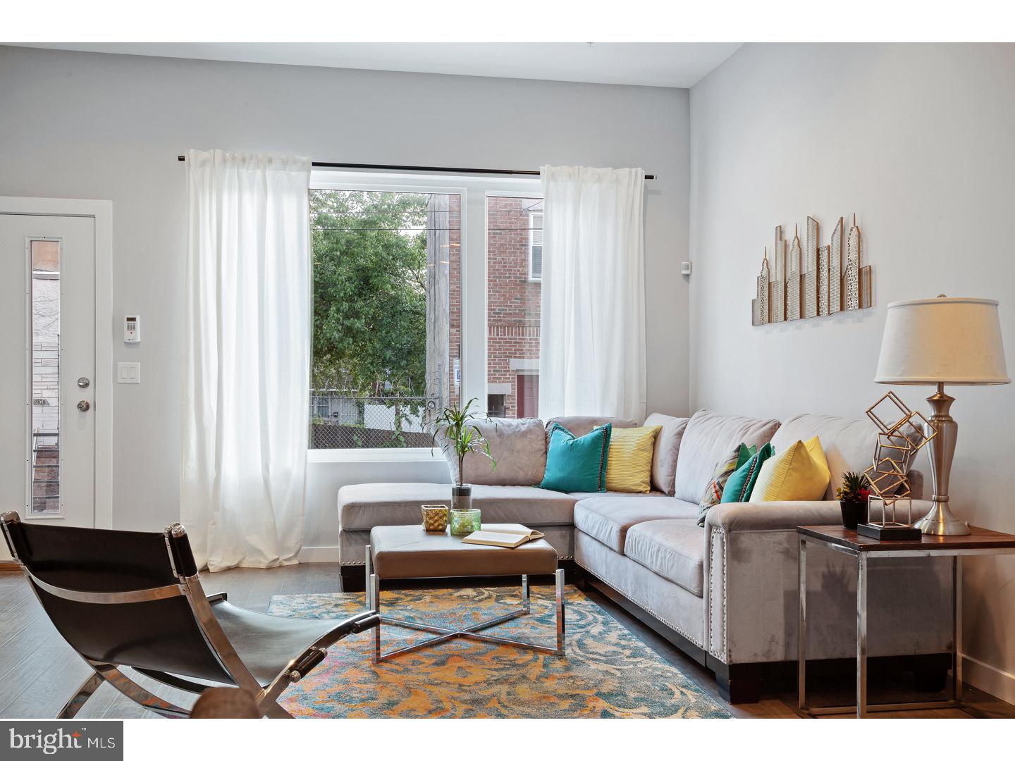 What a great time to move-in to this spectacular New Construction, 3 story home with 3 bedrooms, 2.5 baths, a panoramic roof deck, finished basement, and 10-year tax abatement in the highly desired neighborhood of Fishtown! Features include luxury finishes, solid hardwood floors throughout, recessed lighting, beautiful paired kitchens, and baths. The open layout first floor features high ceilings,  built-in shelving, recessed lighting, and effusive natural light. Two spacious bedrooms with ample closet space and full hall bath make up the 2nd floor and the 3rd level consists of the master suite with a stunning custom bath and access to the captivating roof deck scenery. Located near all of the major shopping, dining, and nightlife attractions of Frankford & Girard aves as well as being supremely convenient to public transportation and main roadways.  We welcome your visit today!