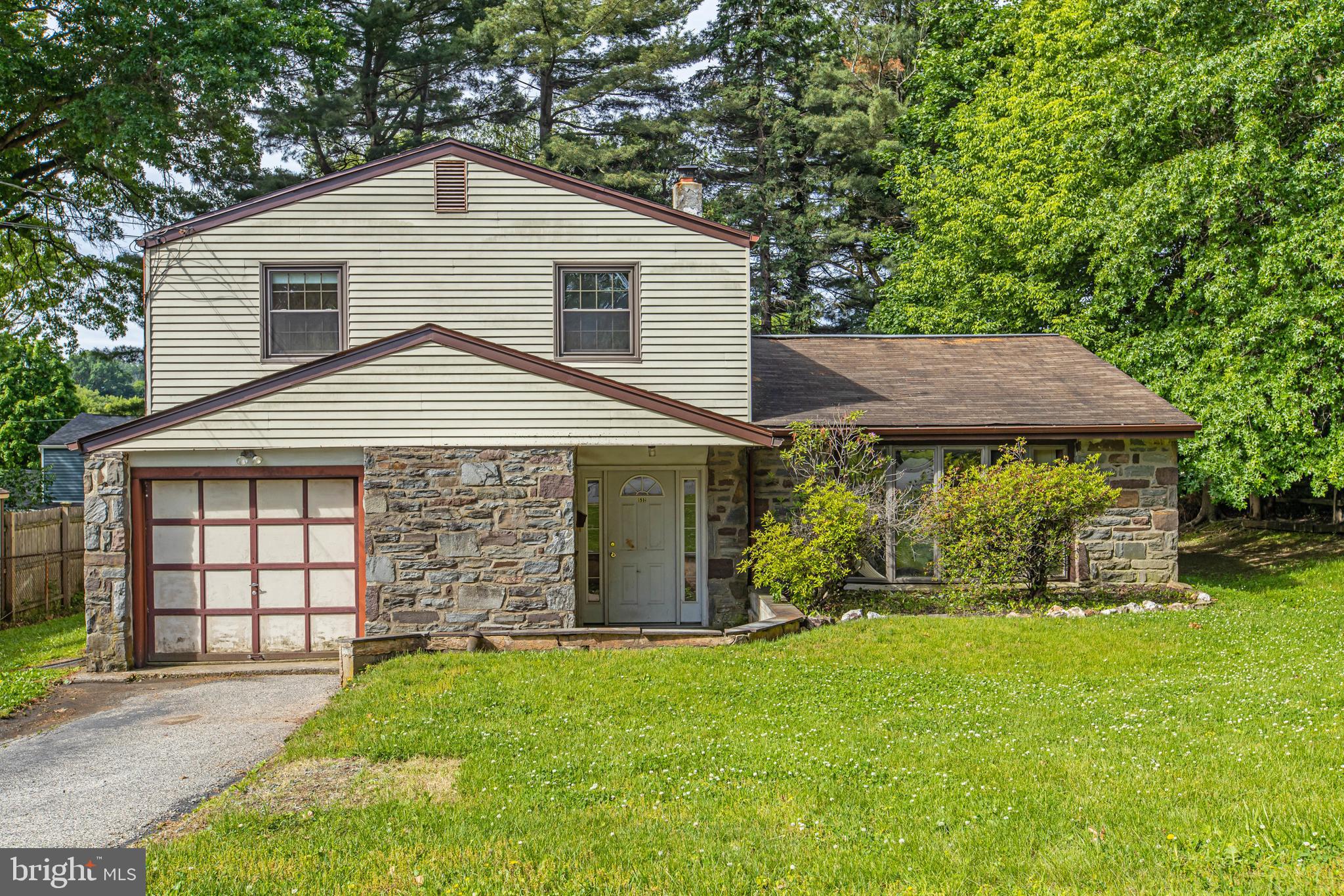 Welcome to 532 Cedar Drive, a beautifully situated 3-bedroom, 2.5-bath split-level home tucked away at the end of a quiet cul-de-sac in one of Lafayette Hill's most desirable and established neighborhoods. Set on a level, fenced .25-acre lot, this property, located right on the cul-de-sac, offers exceptional privacy with mature trees providing a natural buffer from neighboring homes. Natural gas-fired forced-air heating and central air conditioning provide year-round comfort and convenience.
The home's timeless curb appeal is highlighted by an impressive Pennsylvania gray and gold fieldstone façade spanning the entire front elevation, complemented by a covered entry, newer front door with sidelights, a deep attached one-car garage, and an ample two-car driveway. Inside, an inviting foyer opens to a thoughtfully designed floor plan featuring a spacious formal living room with vaulted ceiling, formal dining room, and a comfortable family room with direct access to the rear patio and backyard.
The eat-in kitchen offers abundant natural wood cabinetry, generous counter space, a peninsula with seating, and plenty of room for everyday dining. Hardwood flooring enhances the living room and kitchen, while attractive tile flooring extends throughout much of the main living area. Ceiling fans in the family room, eat-in kitchen, and all three bedrooms provide year-round comfort, while updated lighting fixtures throughout the home add warmth and functionality. Upstairs, the primary suite features a private full bath, while two additional bedrooms share a well-appointed hall bath.
Outdoor living is equally appealing with a rear patio spanning much of the home's width, overlooking the level backyard—ideal for entertaining, gardening, play, or simply enjoying the peaceful surroundings.
While the home would benefit from some updating and TLC, it presents an outstanding opportunity for buyers to build equity and customize the space to their tastes. With solid bones, a desirable floor plan, exceptional privacy, and a sought-after Lafayette Hill location, this property is the perfect canvas for creating your dream home. The property is being sold as-is by a family member who has not occupied the home for many years, offering buyers the opportunity to perform their own due diligence and make improvements that suit their vision.
Conveniently located just minutes from Lafayette Hill's parks, shopping, and dining, as well as vibrant downtown Conshohocken, residents enjoy easy access to popular restaurants, nightlife, SEPTA rail service to Center City Philadelphia, the Schuylkill River Trail, Manayunk, and the renowned Wissahickon Valley trail system. Offering a wonderful combination of privacy, character, convenience, and opportunity, 532 Cedar Drive is ready to welcome its next chapter.