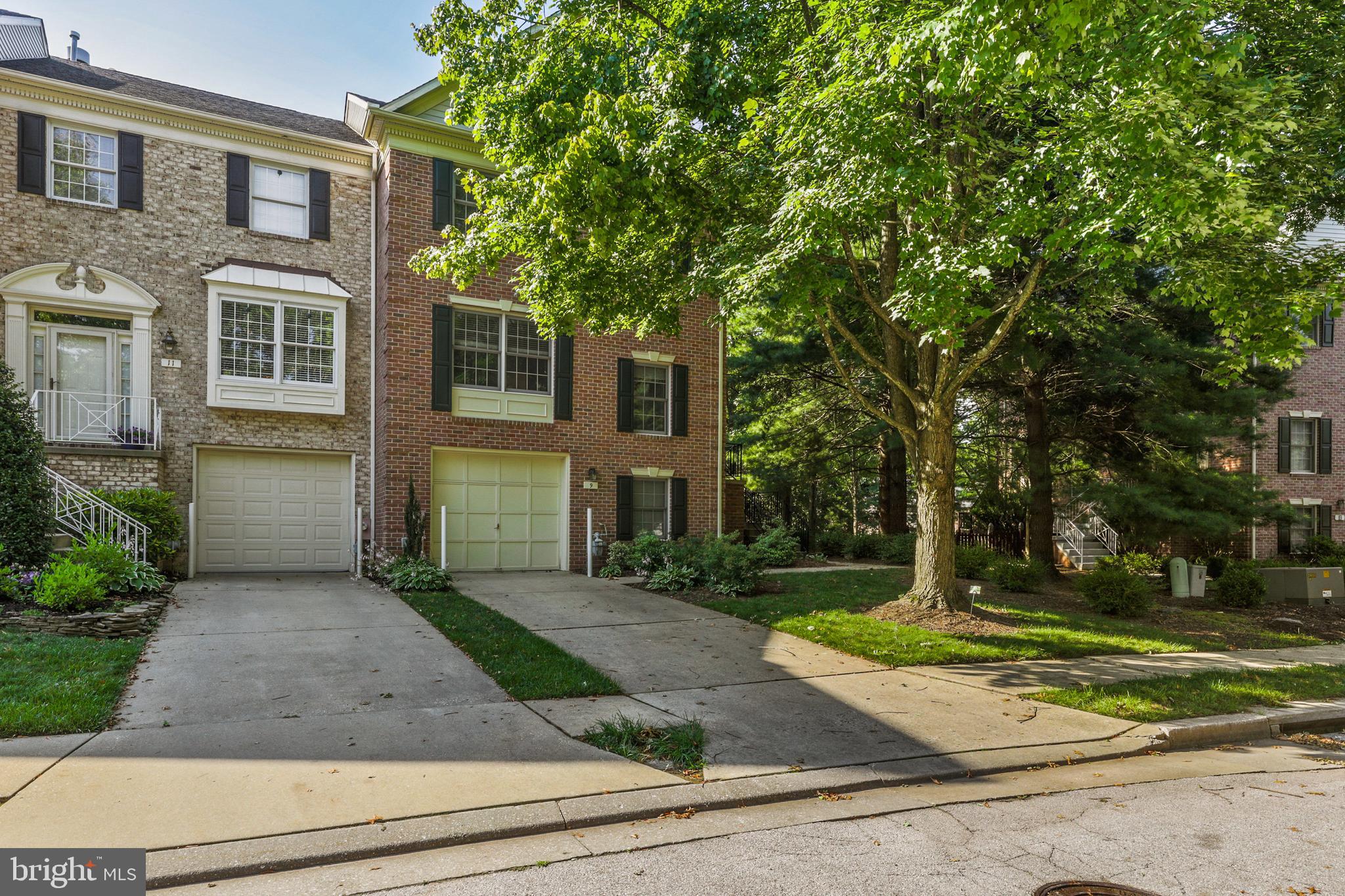 All brick end unit in Mays Chapel North with attached garage.  Fresh paint throughout!  Beautiful hardwood floors and updated eat-in kitchen on the main level with access to rear deck.   Upstairs features 3 large bedrooms & 2 full bathrooms.  The owners suite has a large walk in closet and updated bathroom.    The lower level is fully finished with an additional bedroom / flex space with a 1/2 bath plus walk out sliding glass door to backyard.    A+ location & move in ready!