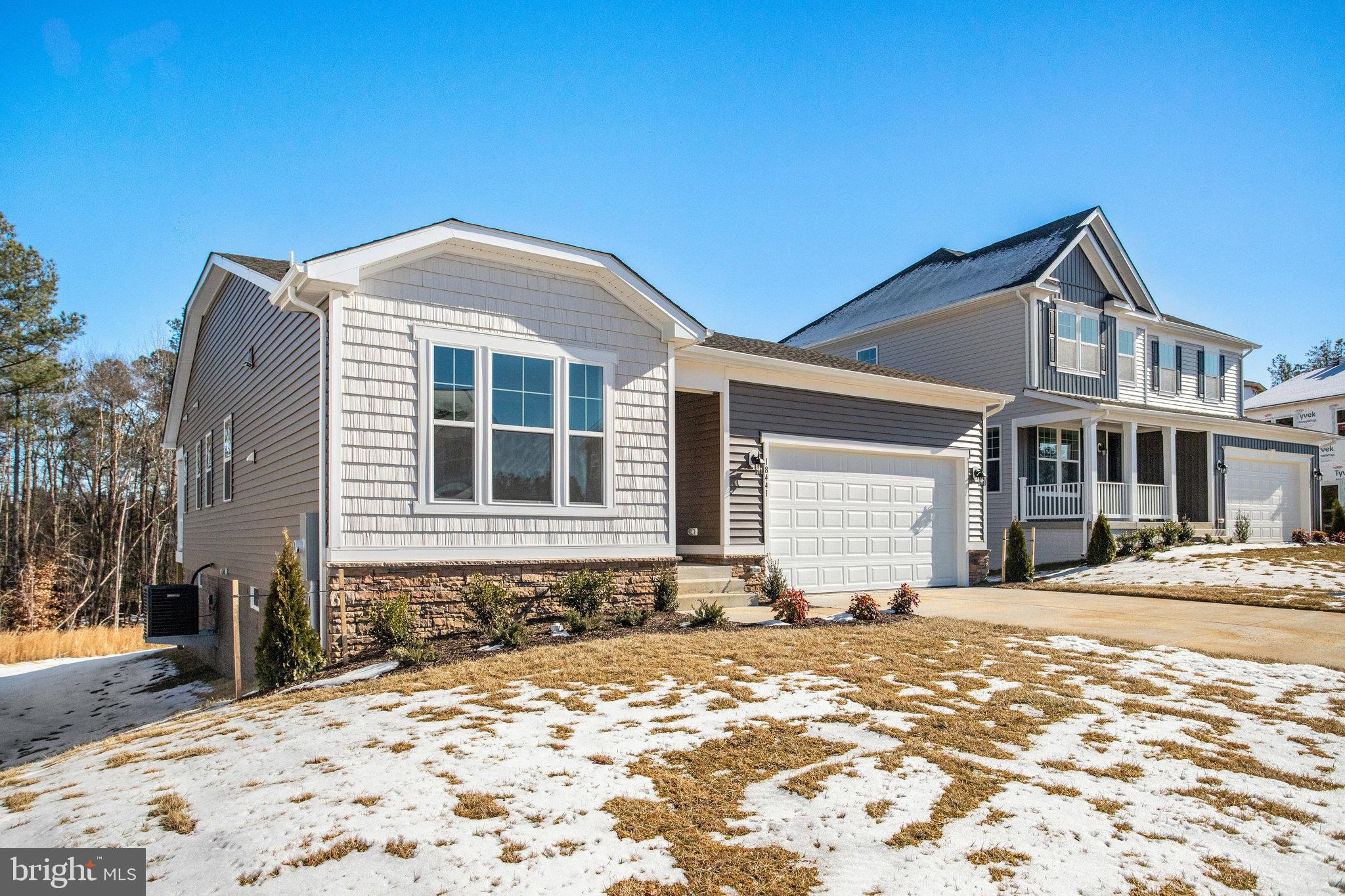 This new ranch-style model home includes an inviting great room with fireplace and a well-designed kitchen with stainless-steel appliances, tile backsplash, luxury vinyl plank flooring, a built-in pantry and an adjacent dining room. The luxurious primary suite offers a roomy walk-in closet and lavish bath with double sinks. You'll also appreciate the private study, extended covered deck and unfinished walkout basement. Backs to trees.