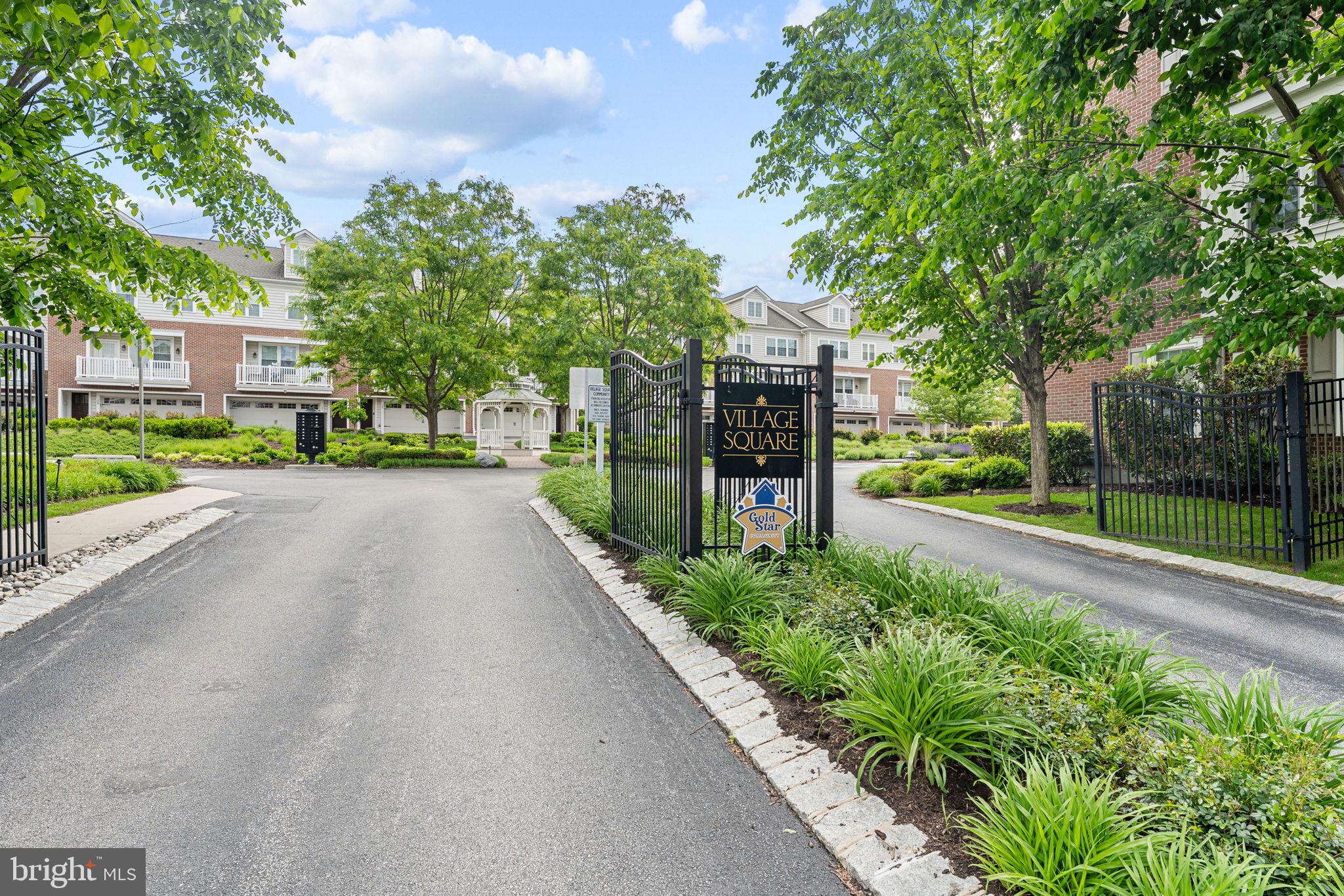 THIS PROPERTY HAS A 4-STOP ELEVATOR. Welcome to 53 Village Square, a beautiful customized townhome offering low-maintenance living in one of Paoli's most convenient locations. Situated within the highly regarded, award-winning Tredyffrin Easttown School District, Village Square is a sought-after Gold-Star community of just 30 homes, ideally positioned within a short walking distance of the Paoli Shopping Center, Paoli Library, and the Paoli Train Station with SEPTA and Amtrak service for commuters heading to Philadelphia, New York, and beyond. Inside, the flexible floor plan offers four levels of living space designed to adapt to a variety of lifestyles with a 4-STOP ELEVATOR allowing for ultimate convenience and accessibility. The entry level features direct garage access and a versatile bonus room that can serve as a home office, fitness space, den, playroom, or media room. The main living level is designed for both everyday living and entertaining. The open floor plan provides a seamless flow between the living room, dining area, and the kitchen, which serves as the heart of the home. It features an oversized quartz island, stainless steel appliances, gas cooking, and pantry storage with ample storage space in its many cabinets. The adjoining dining area flows seamlessly into the living room, where custom built-in cabinets and shelves flank a gas fireplace and a private balcony provides the perfect spot to enjoy your morning coffee or unwind at the end of the day. A convenient half bathroom rounds out the main living area. Upstairs, the primary suite offers two generous walk-in closets   and a well-appointed bath with dual vanities and a large tiled shower. A second ensuite bedroom with adjoining full bathroom, a dedicated laundry room with utility sink, and ample storage complete the level. The top floor provides exceptional flexibility with a third bedroom, full bath, and multiple storage closets. Whether used as a guest suite, home office, family room, or library, the space easily adapts to your needs. Additional features include four-zone high-efficiency heating and cooling at a very low cost, a tankless water heater, fire suppression system, and security system wiring (not currently hooked up). Residents of Village Square enjoy a beautifully maintained courtyard with gazebo, abundant guest parking, and an HOA that handles landscaping, snow removal, trash service, and exterior common area upkeep—allowing homeowners to spend less time on maintenance and more time enjoying everything this walkable Paoli location has to offer.