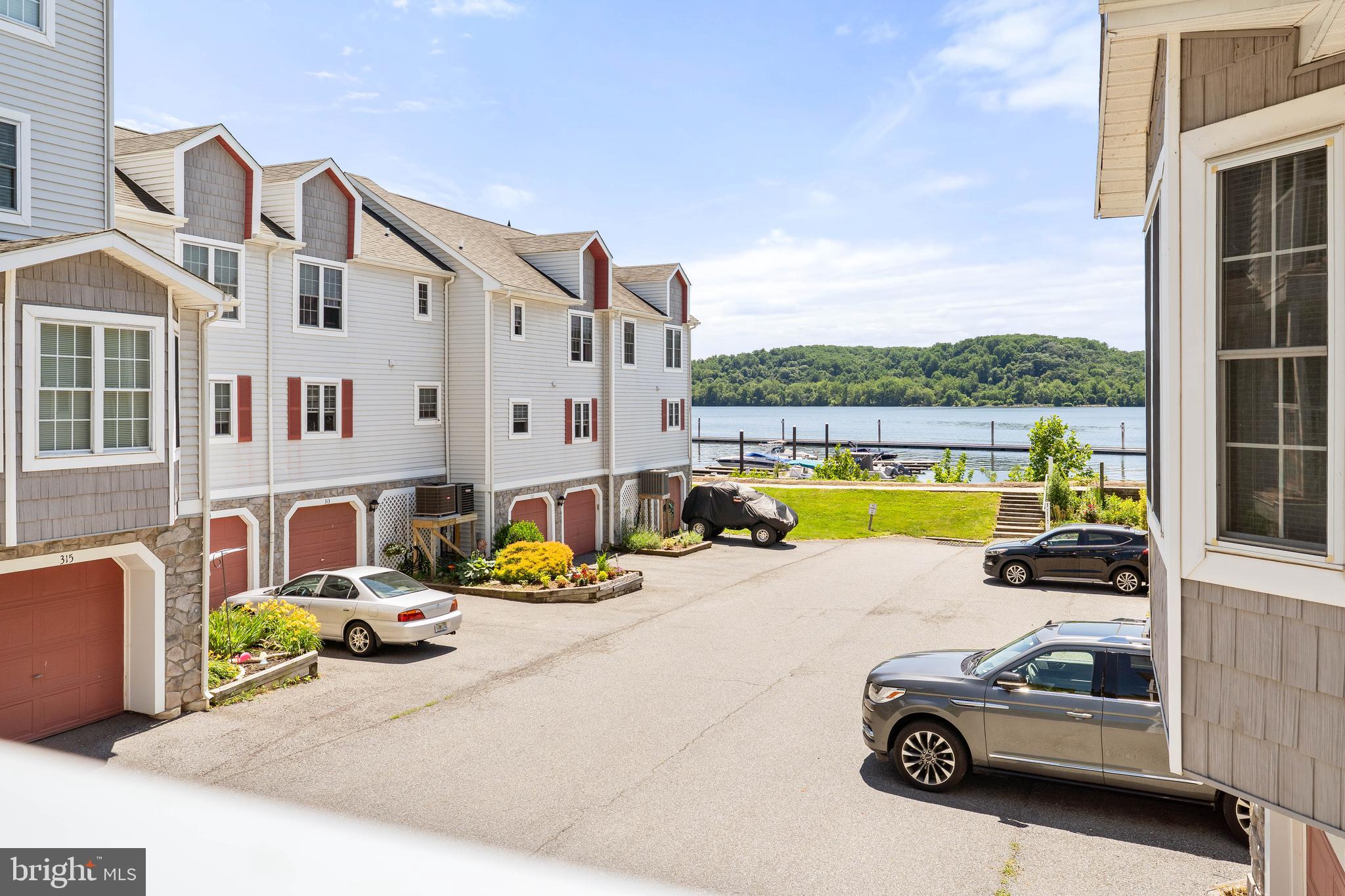 Vacation where you live in this meticulously maintained 2 bed, 2 bath condo in the waterfront community of Tomes Landing! Kitchen is open to the large living room and has sliders to side balcony. Both bedrooms are quite large including an owner's suite that also has sliders to the balcony where you will find great water views!  Washer and dryer are included in the unit as well as a very large pantry and storage. 1 car garage and a pool membership that's included in your condo fees. Walking distance to a few outstanding restaurants nearby where you'll find excellent food and entertainment! Close to marina and boat ramps. Minutes to 95 and Rte 40! Right in between Philly and Baltimore for an easy commute.