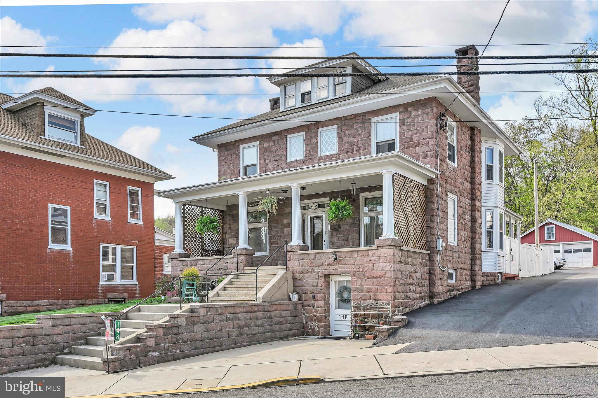 A truly exceptional 1860 solid stone residence, offering timeless character and refined living in the highly sought-after Cocalico School District. Located in **Adamstown—renowned as the Antiques Capital this distinguished home is a rare blend of preserved craftsmanship and thoughtful enhancements.
A private in-law or guest suite, completely remodeled in 2025, features two bedrooms, a spa-inspired walk-in shower, in-suite laundry, and separate front and rear entrances, providing flexibility for multigenerational living or extended guests.
The main residence offers four bedrooms, two walk-through, and two full baths, including a conveniently located laundry room/bath on second floor. Original architectural details reflect the home’s historic pedigree, with pocket doors, French doors, deep window sills, and custom built-in cabinetry, showcasing the enduring quality and artistry of a bygone era.
Outdoor living is equally impressive, featuring a generous covered front porch ideal for quiet mornings or evening relaxation, and a fenced rear patio perfect for private entertaining. Beyond the garage, a sprawling yard transitions into a wooded backdrop, providing direct access to the Horseshoe Trail, with approximately 140 miles of scenic hiking.
Ideally located near major highways, this home offers the rare combination of historic charm, natural beauty, and modern convenience. Please review the full seller disclosures attachment which document the extensive upgrades, improvements, and attentive maintenance that elevate this home to a true legacy property. Don't miss the attic, a private partially finished room has many possibilities for quiet time, projects or office. New gas furnace replaced oil in 2015.