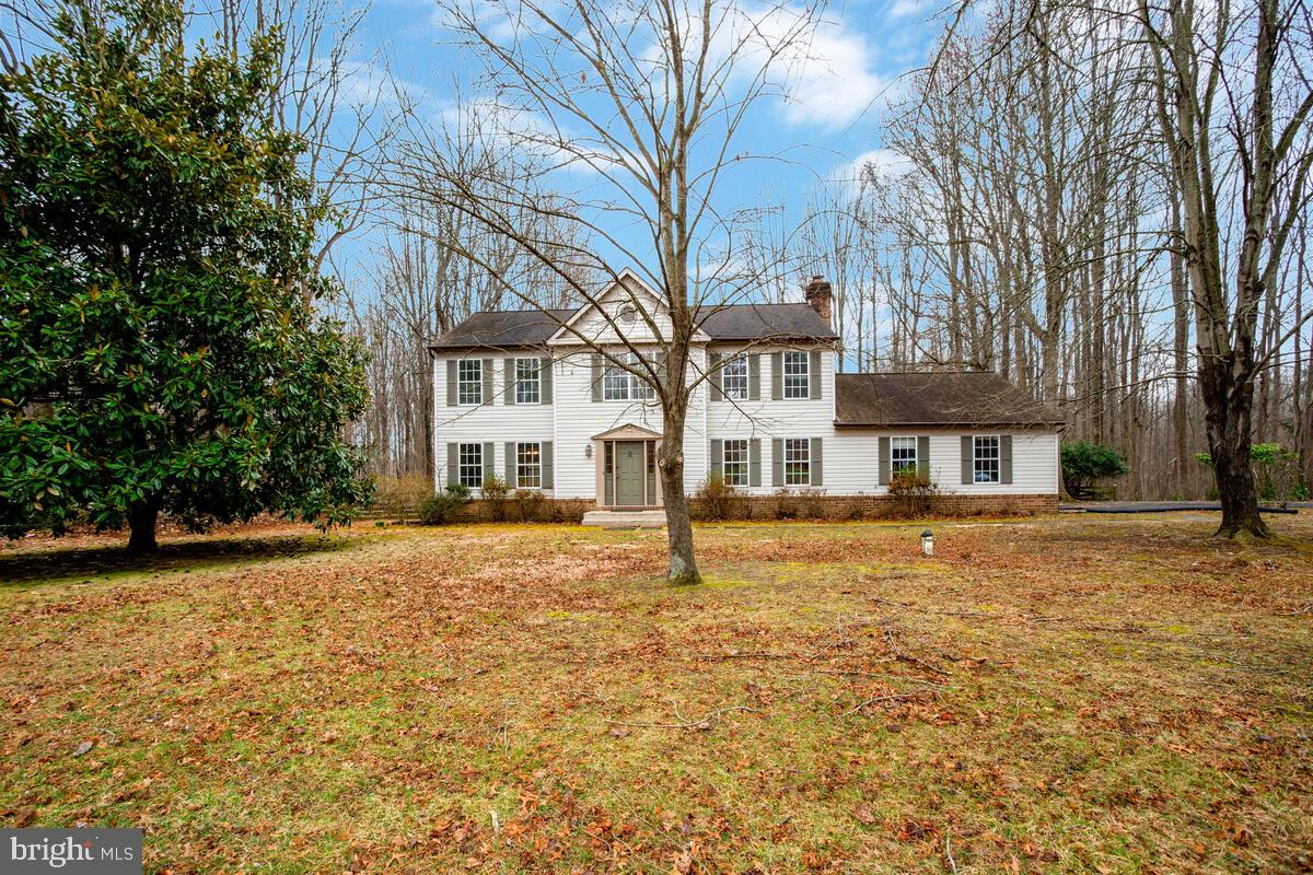 Nestled on a picturesque 2-acre lot, this spacious home offers the perfect blend of open and wooded space—one acre is fenced and cleared, while the other provides a natural, wooded retreat. Inside, the inviting family room features a cozy fireplace, perfect for gathering. The spacious kitchen boasts a pantry and flows effortlessly into the separate dining and living rooms, ideal for entertaining. A charming, light-filled breezeway connects the kitchen and the laundry/mudroom, making a perfect sunlit spot for plants. The mudroom also offers a brand-new utility sink and direct access to the side-load 2-car garage.
Upstairs, the expansive primary suite includes a sitting area, a generous walk-in closet, and an en-suite bath with a double vanity. Freshly painted throughout with brand-new carpet, this home is truly move-in ready! The huge unfinished basement provides endless potential, with a bathroom rough-in and an exterior exit, making it easy to customize for additional living space. Great location - country feel yet super convenient to shopping and parks.  Floor plan and location survey are included in the documents. Don’t miss this incredible opportunity!