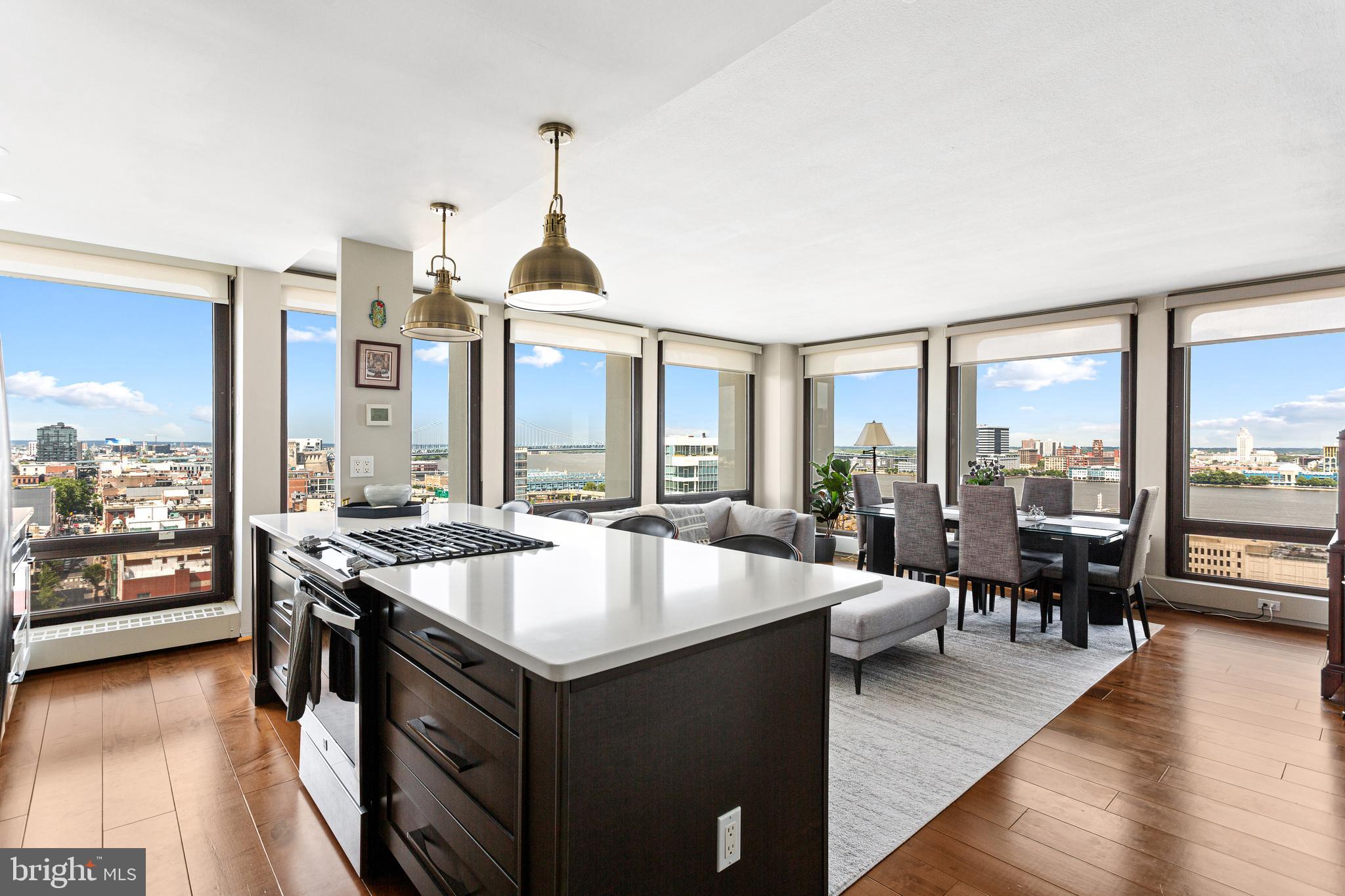 Welcome to Unit 16D in Society Hill Towers! This beautifully renovated corner 1-bedroom, 1-bath residence offers breathtaking skyline and river views through expansive floor-to-ceiling windows. The open-concept layout features wide-plank hardwood floors, a modern kitchen with quartz countertops, shaker cabinetry, stainless steel appliances, marble backsplash, and a large island with seating. The spacious bedroom is filled with natural light and complemented by a stylishly updated bathroom with premium finishes. Residents enjoy exceptional amenities including 24-hour concierge and security, a fitness center, saltwater pool, garage parking for an additional fee, on-site laundry, market, dry cleaning services, and beautifully maintained grounds. Located in the heart of Society Hill, you'll be just steps from renowned restaurants, entertainment, historic landmarks, Penn's Landing, and Center City, with easy access to hospitals, I-95, and South Jersey. Don't miss this opportunity to enjoy luxury living with unbeatable views and convenience, schedule your showing today!