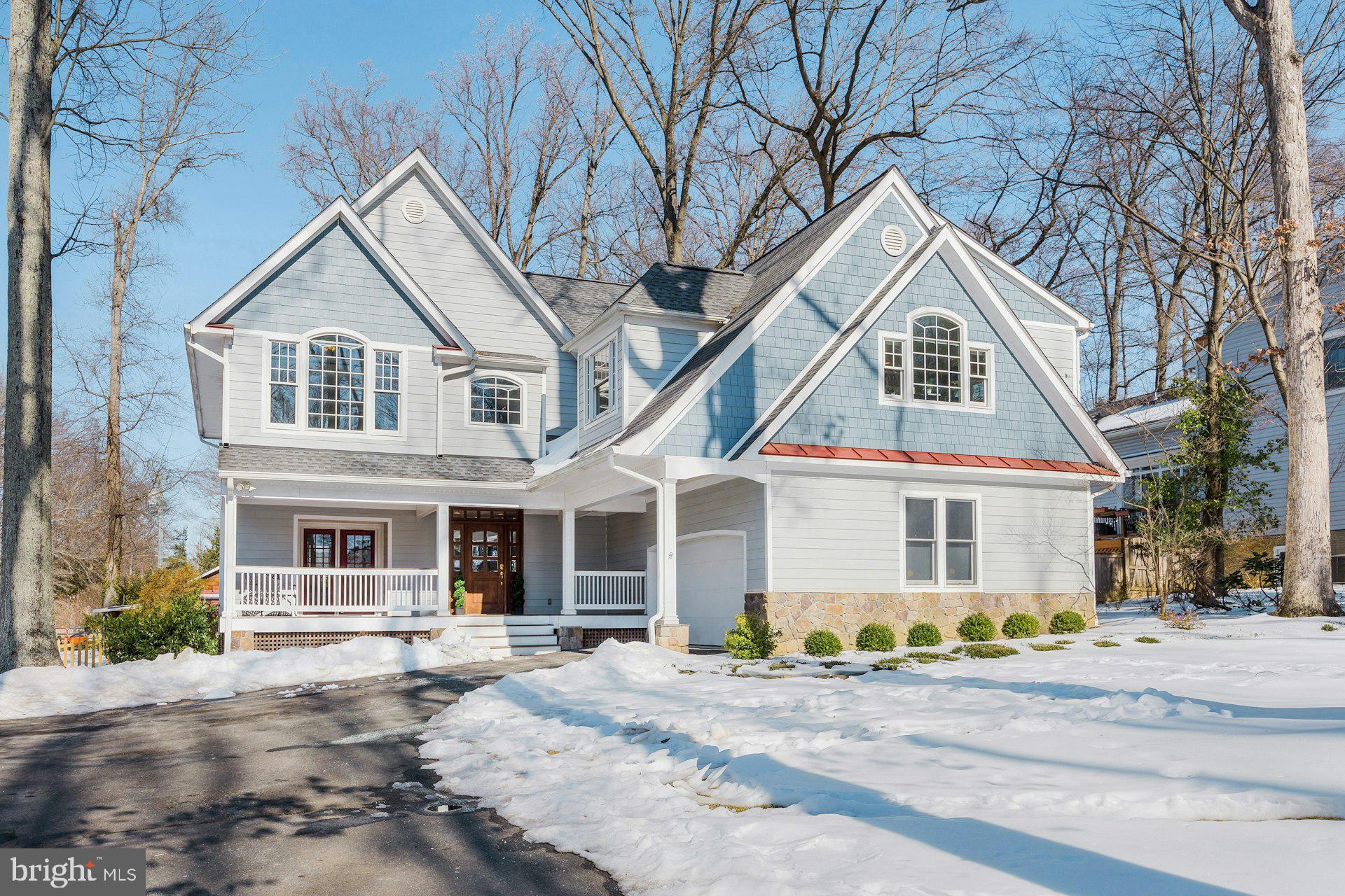 ** Price Improvement** Sited on a half acre lot on one of Vienna's most desirable tree-lined streets, this stunning  home underwent a thoughtful, top-to-bottom renovation in 2004, adding a second story with spacious bedrooms, including connecting lofts,  creating a child's dream play space!  With a one-of-a-kind custom layout with loads of natural light, high ceilings  and  an exceptional flow, this home is freshly painted with newly refinished hardwoods throughout the main level.  Numerous updates include a showcase kitchen and 3 renovated bathrooms. Kitchen with a large island, custom cabinetry, high end stainless steel appliances, quartz countertops & pantry boasts a cozy seating or breakfast area with floor to ceiling stone surround gas fireplace.  Kitchen opens to the living room with dramatic vaulted ceilings and skylights- perfect for entertaining.  Screened porch off dining area with beautiful cherry floors, vaulted ceiling and floor to ceiling stone wood burning fireplace, perfect for relaxing and enjoying the sounds of nature in your private backyard. Separate dining room currently used as a music room . Large office/family room space  with pocket doors for privacy.  Built-ins, desk area perfect for office or homework time plus a separate family room with built in window seats, providing  bonus storage space. Separate laundry room off garage plus hidden extra pantry storage space.  Upper level features a hardwood staircase and hallway with dramatic overlook into living room. A spacious primary suite offers 2 walk in closets and an additional 3rd closet. Bonus alcove perfect for a small office space. Updated primary bathroom with high ceilings, new flooring and  renovated shower, plus soaking tub and private water closet. Hall bath has brand new flooring, vanity, mirrors, and light fixtures. Generous sized bedrooms  with vaulted ceilings. Bedroom  2  (with direct access to hall bathroom) and bedroom 3 have a charming loft play area that connects the 2 bedrooms. Bedroom 4 completes the upper level. Level lot partially fenced with "matching" shed perfect for workshop and storage. Floored attic with pull down stairs  Roof is 3 years old, dual zone HVAC with one replaced in 2020. Water heater 2022. Amazing location just minutes from Tysons, downtown Vienna, Mosaic and the Dunn Loring metro! Easy access to 66 and the Beltway. Walk to elementary and middle schools.
